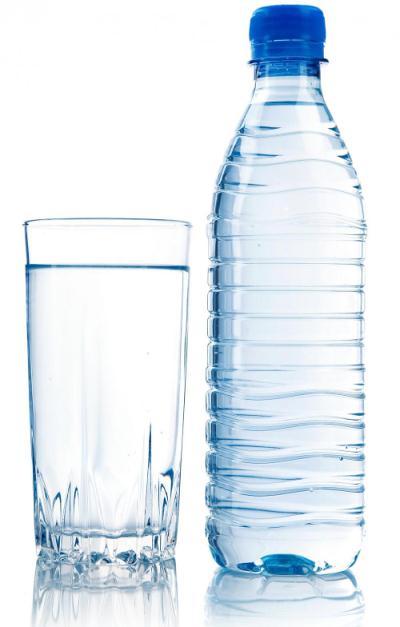 A photo of a glass of water and a bottle of water.