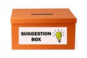 A photo of an orange suggestion box.