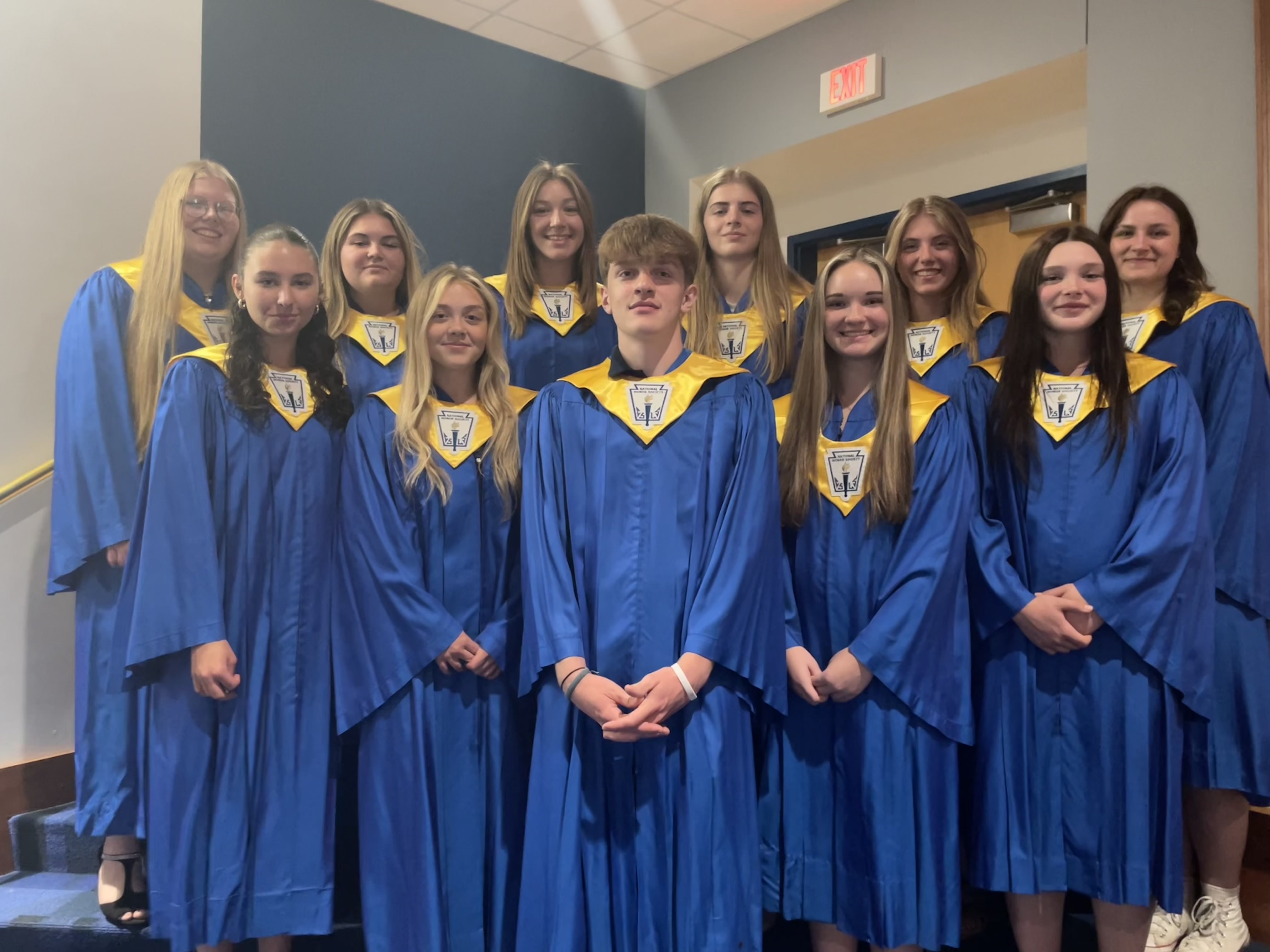 Group photo of 11 juniors in gowns 