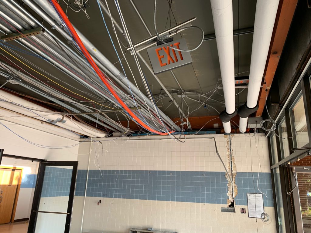 Exposed wires and pipes on the ceiling
