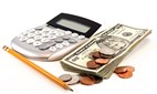 Photo of a calculator and a couple of dollar bills