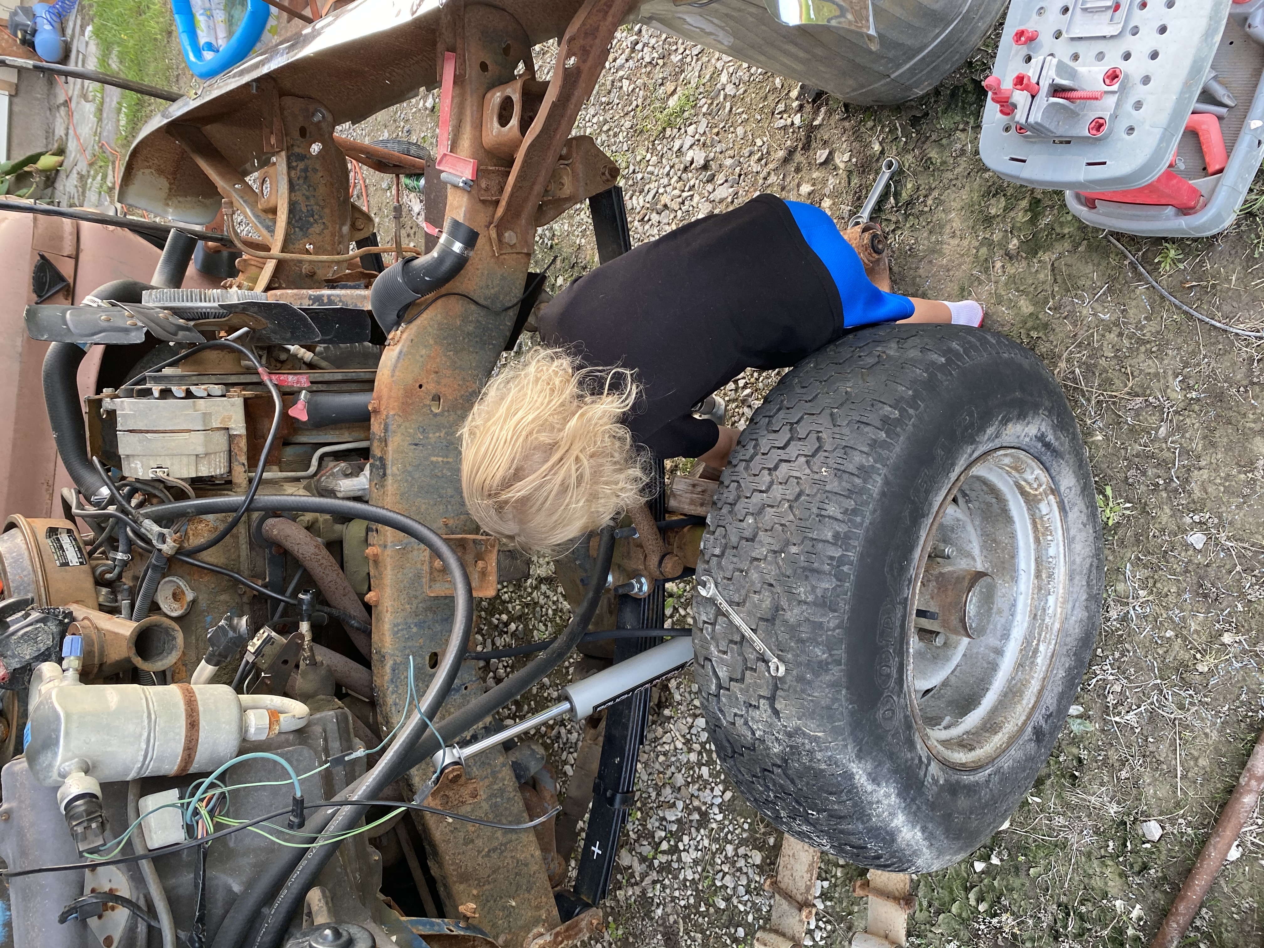 Zylen helping dad to get motor ready to pull