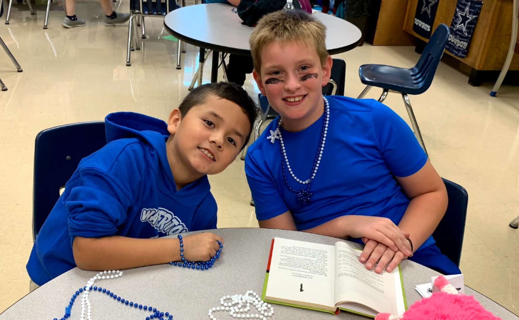 Two boys sitting at a table