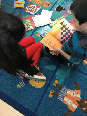 Students working on a project on the floor