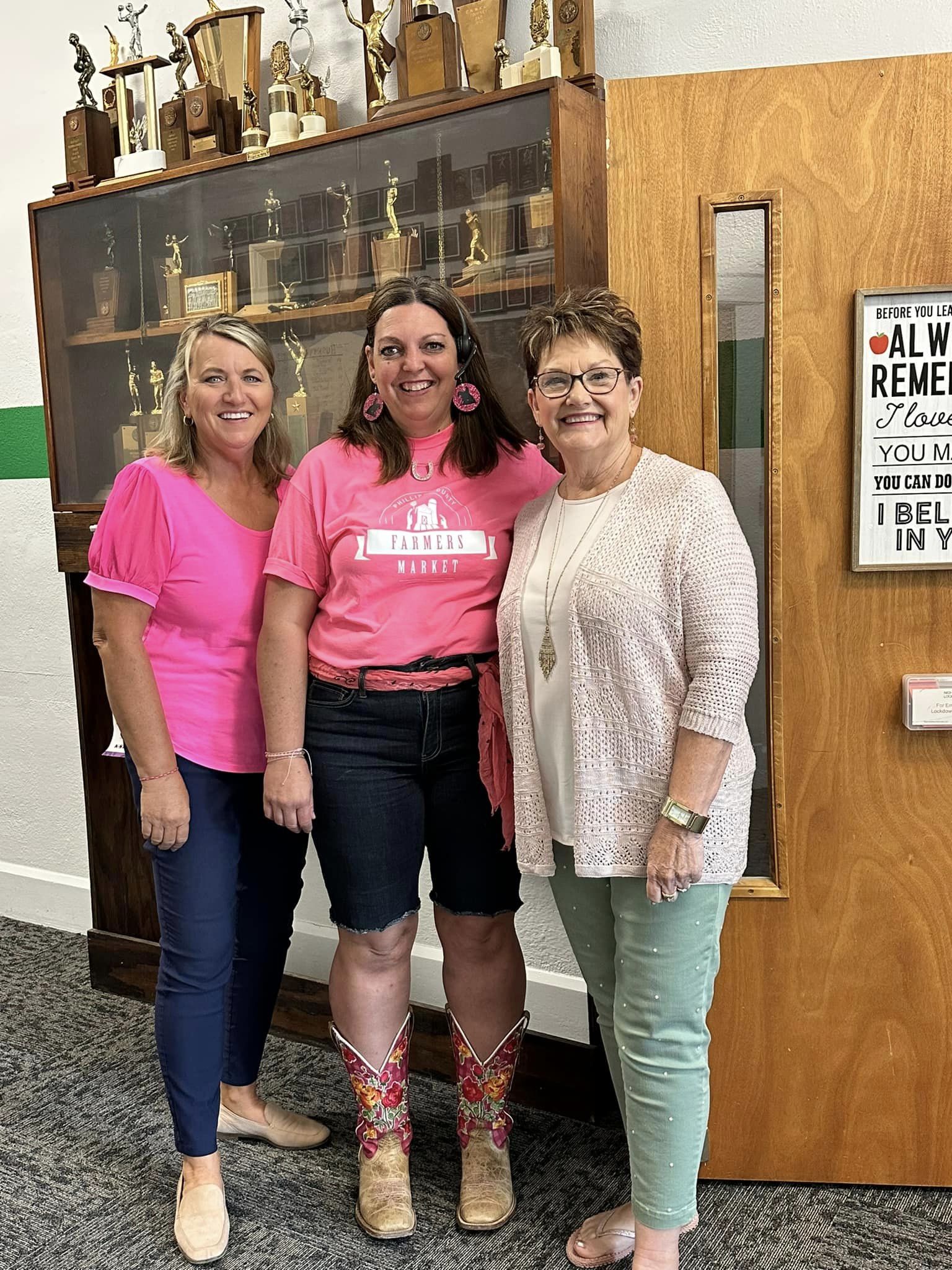 teachers wearing matching pink outfits