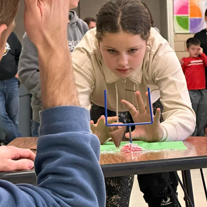 girl focuses on physics problem