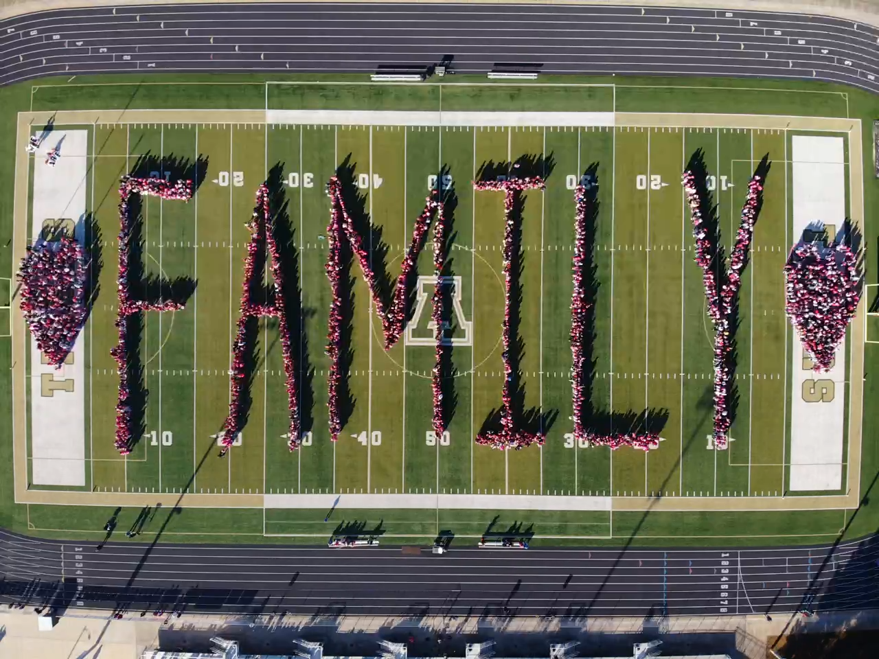 Family spelled out on the AHS football field