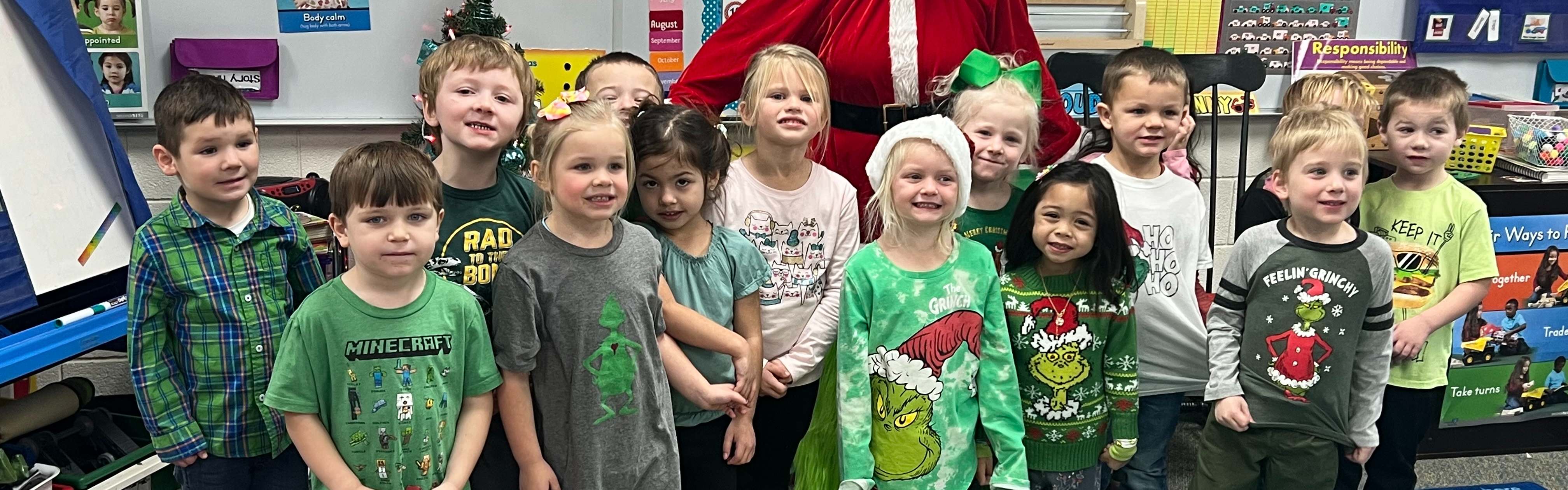 Picture of a preschool class standing together in the classroom before Christmas.
