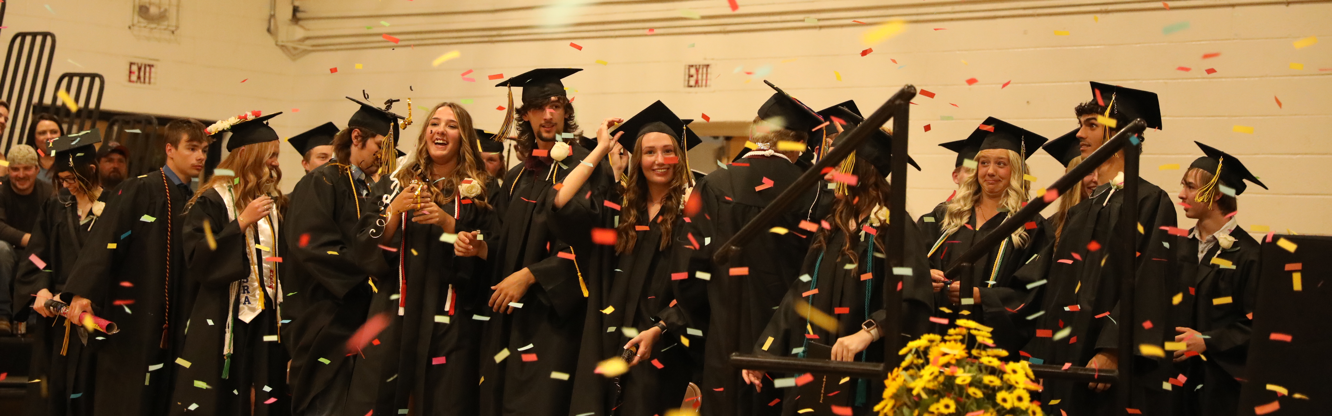 Picture of the graduating class and the confetti flying