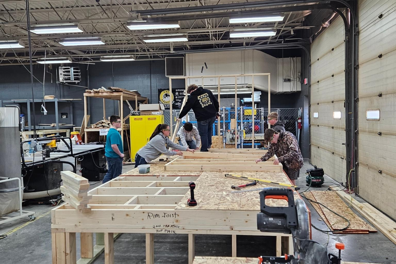 Shop students working on the house they are building in class