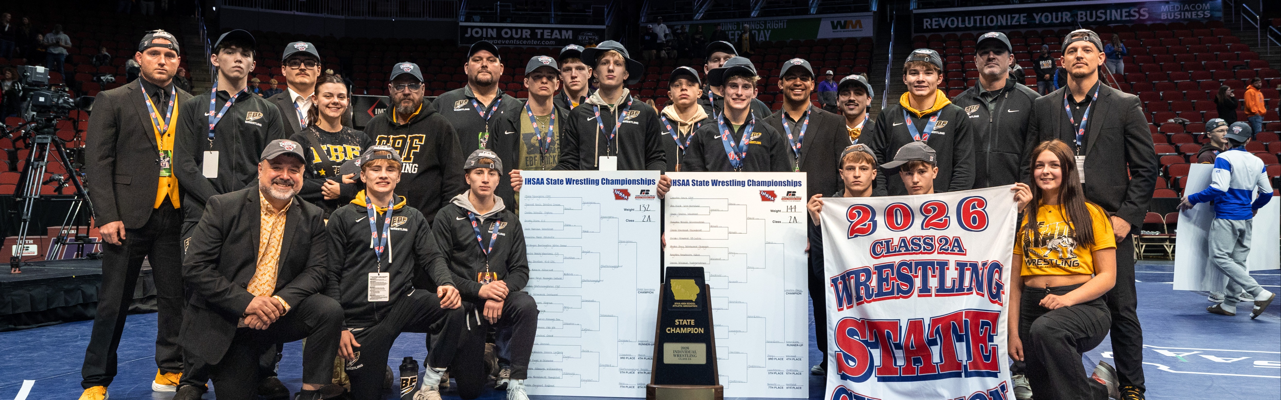 The EBF boys state championship team with their trophy at the end of the state meet