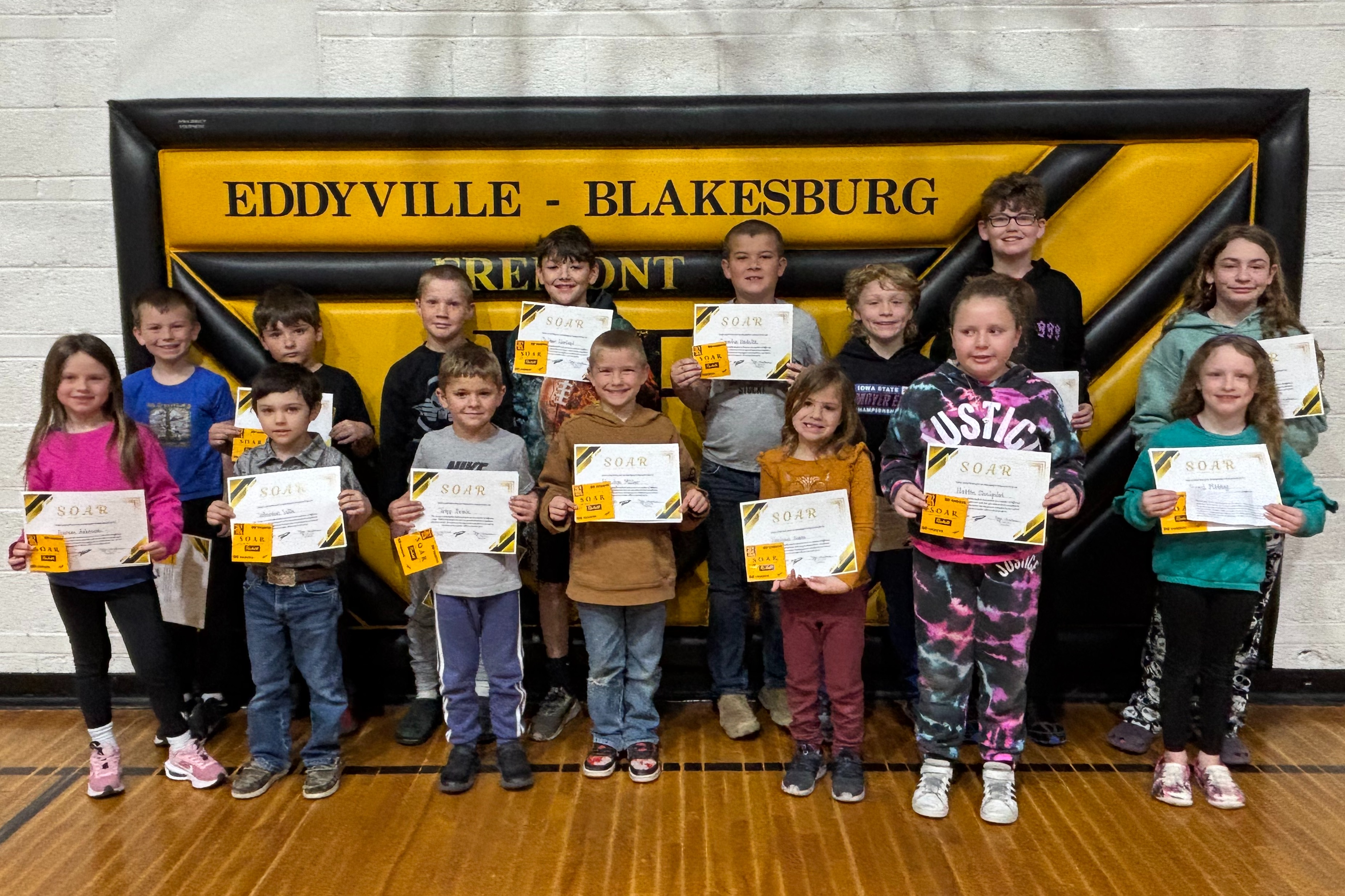 Picture of students from Eddyville Elementary Rockets demonstrating Safety, Ownership, Attitude, and Respect for the month of March