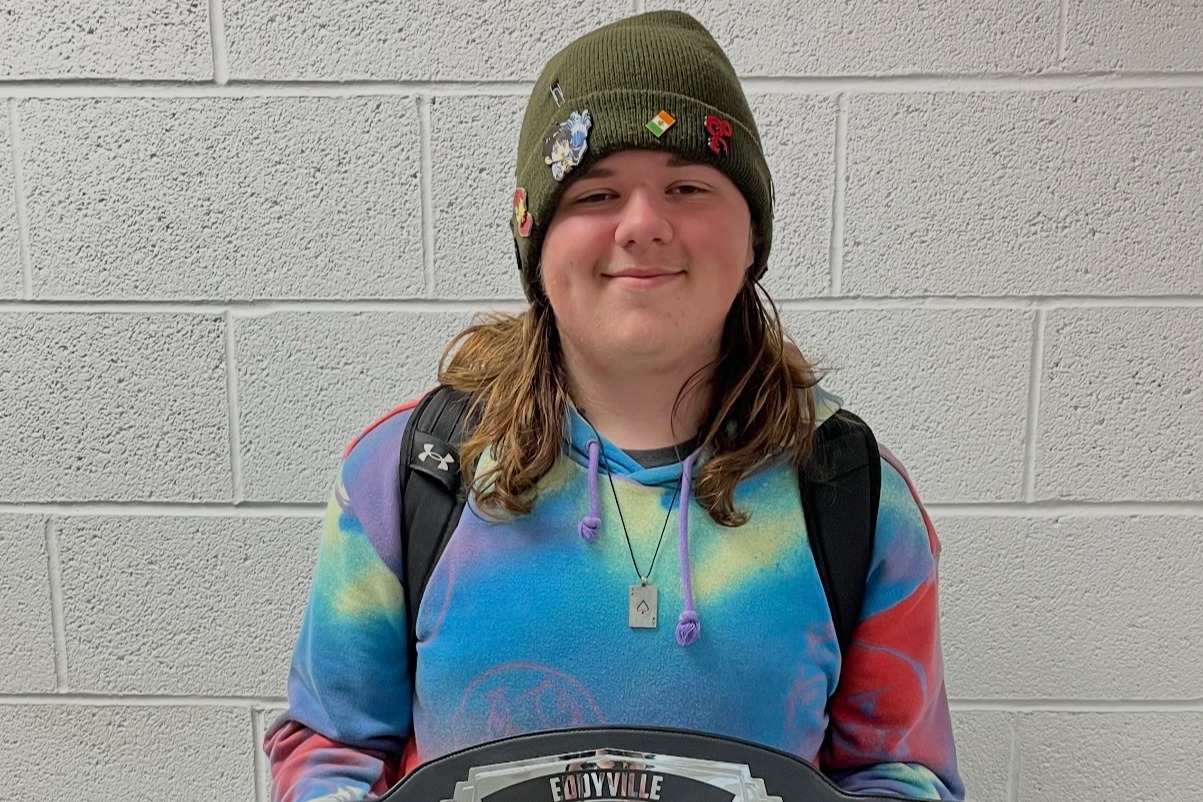 Picture of teenage boy holding the EBF Student of the Week trophy. He is a great young man to have in class. He is a quiet leader, who will take charge in his group and make sure the work is done and that others are doing their part.