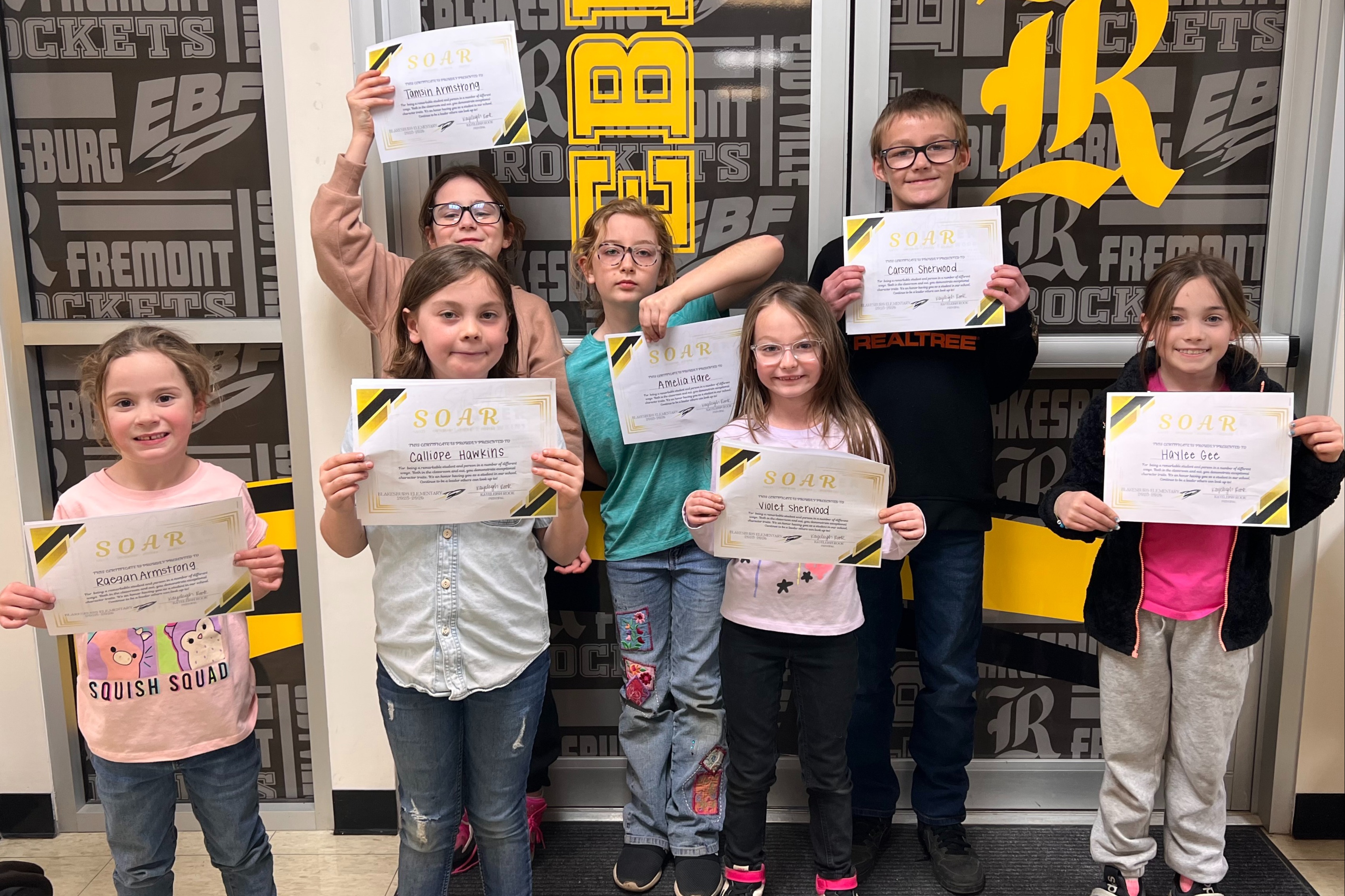 Group of Blakesburg Elementary students holding certificates, recognized as March SOAR Students.