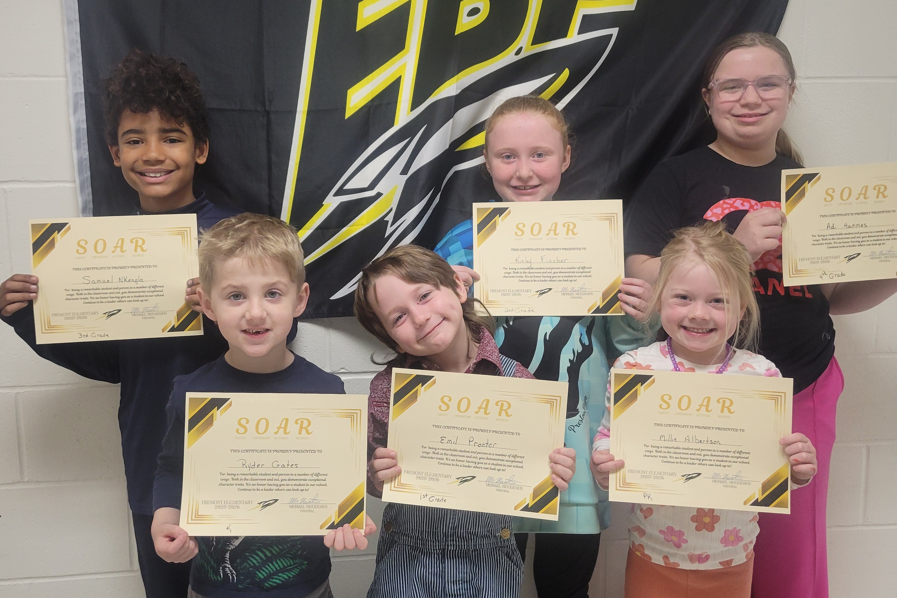 Group of Fremont Elementary students holding certificates, recognized as March SOAR Students.