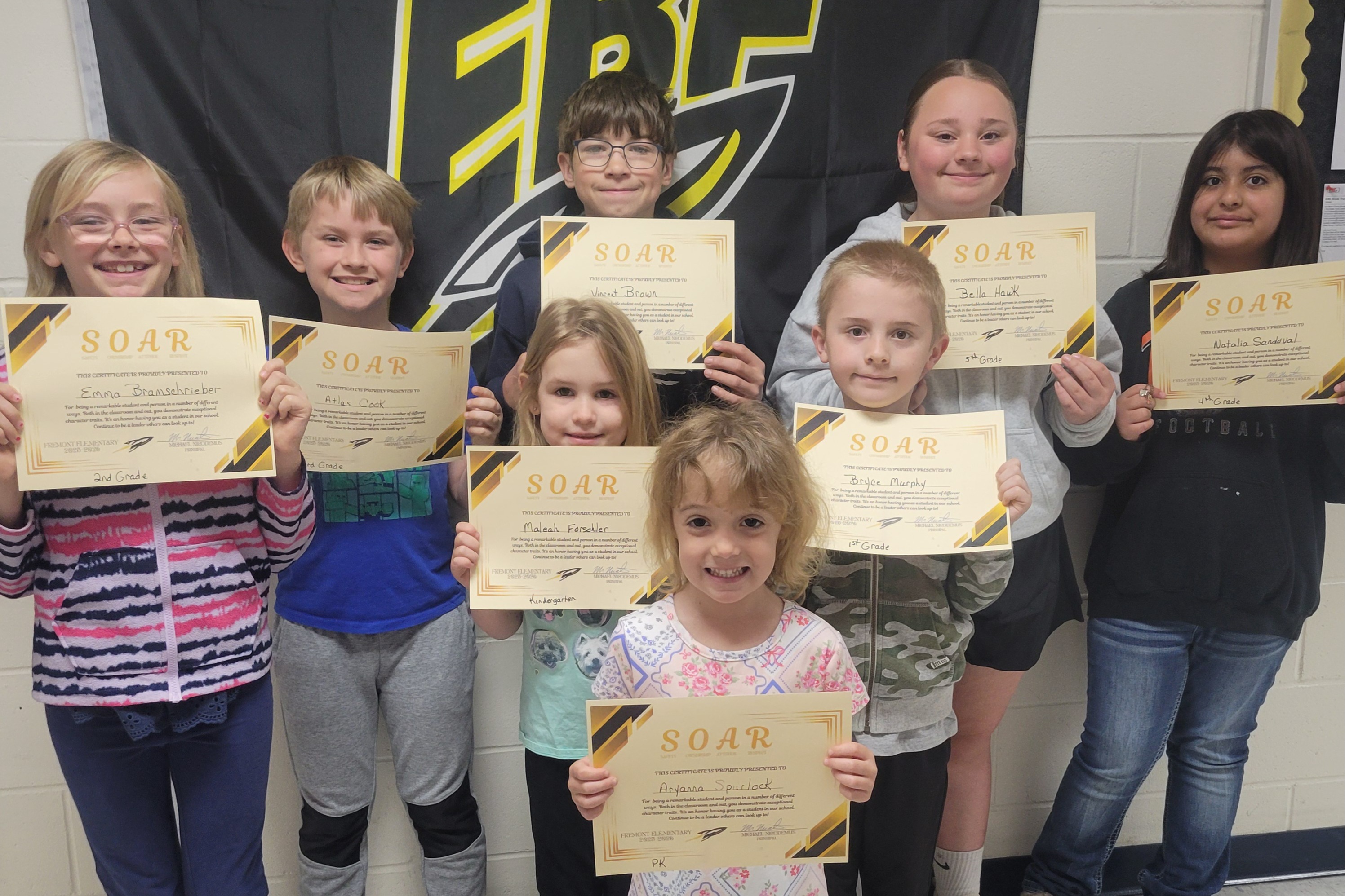 Group of Fremont Elementary students holding certificates, recognized as SOAR Students of the month.