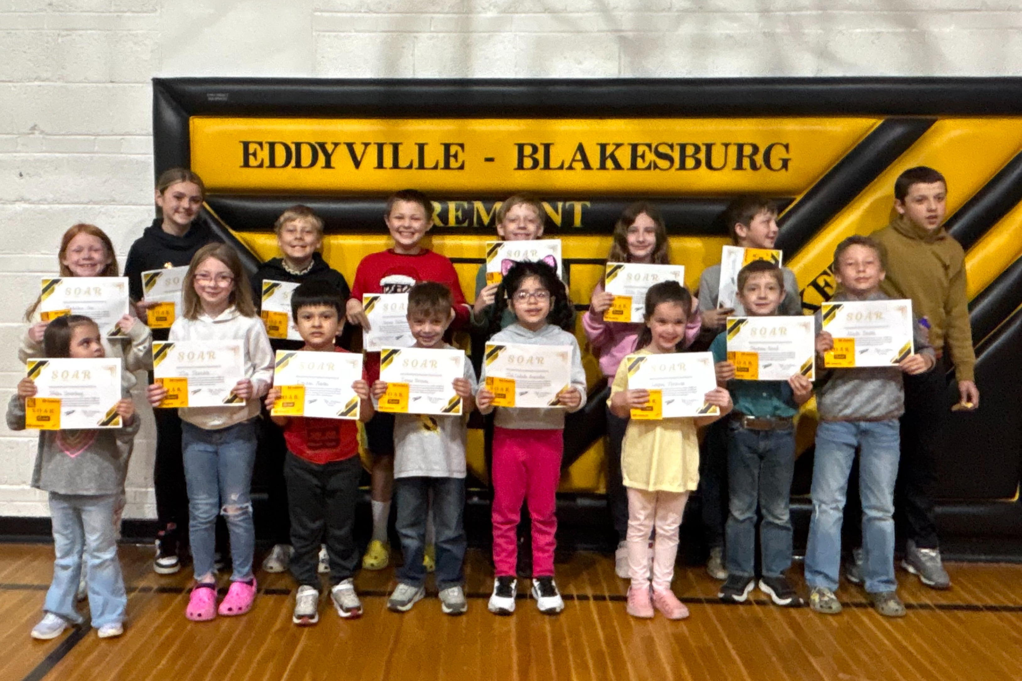 Picture of students from Eddyville Elementary Rockets demonstrating Safety, Ownership, Attitude, and Respect for the month of April
