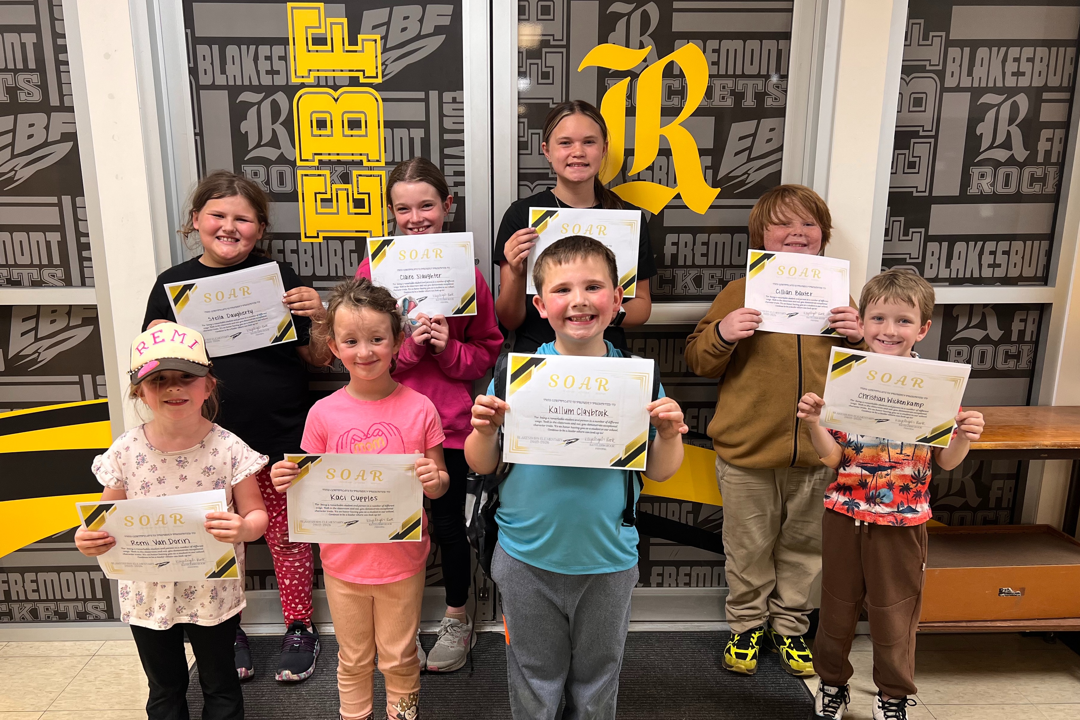 Group of Blakesburg Elementary students holding certificates, recognized as monthly SOAR Students.