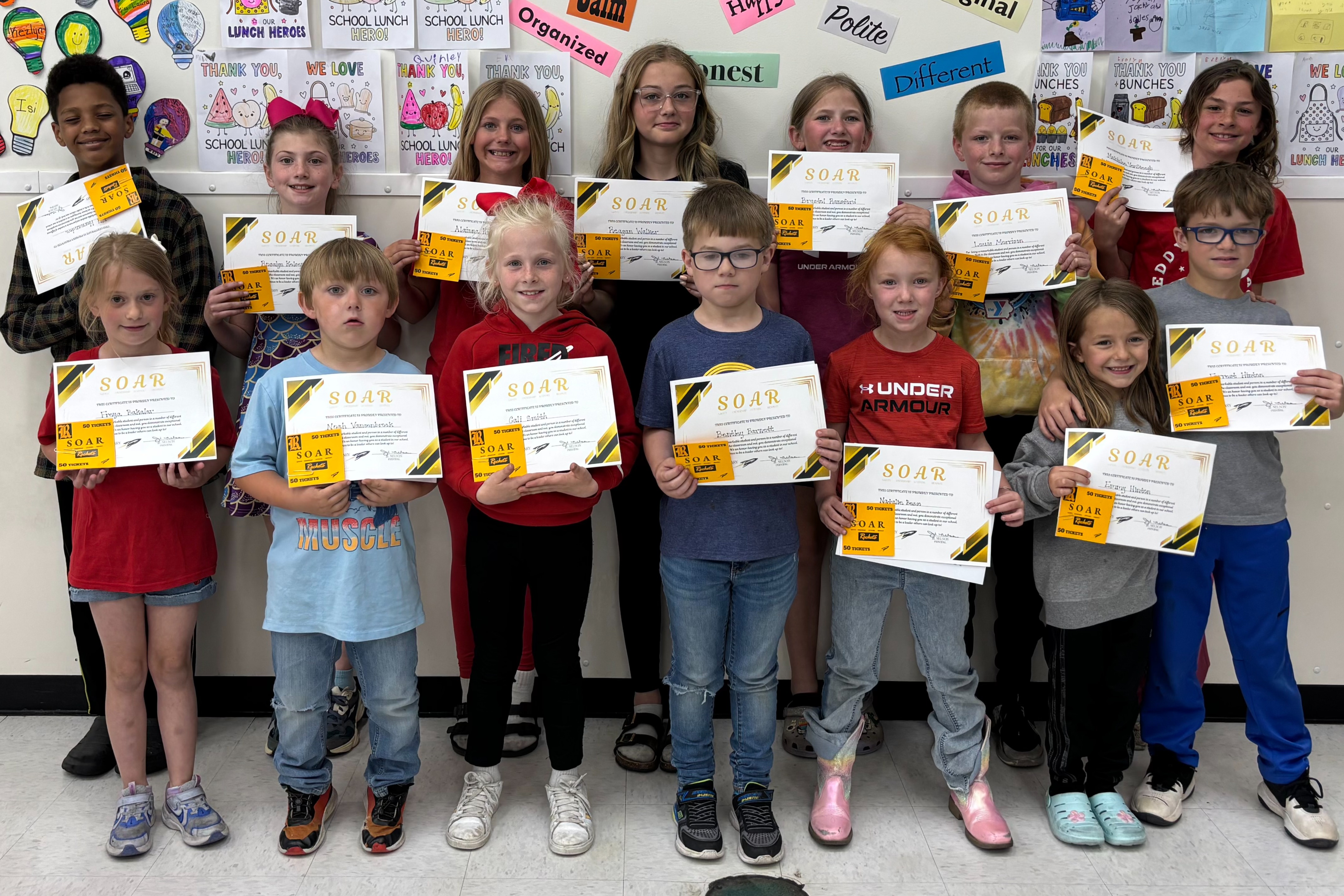 Picture of students from Eddyville Elementary Rockets demonstrating Safety, Ownership, Attitude, and Respect for the month of May