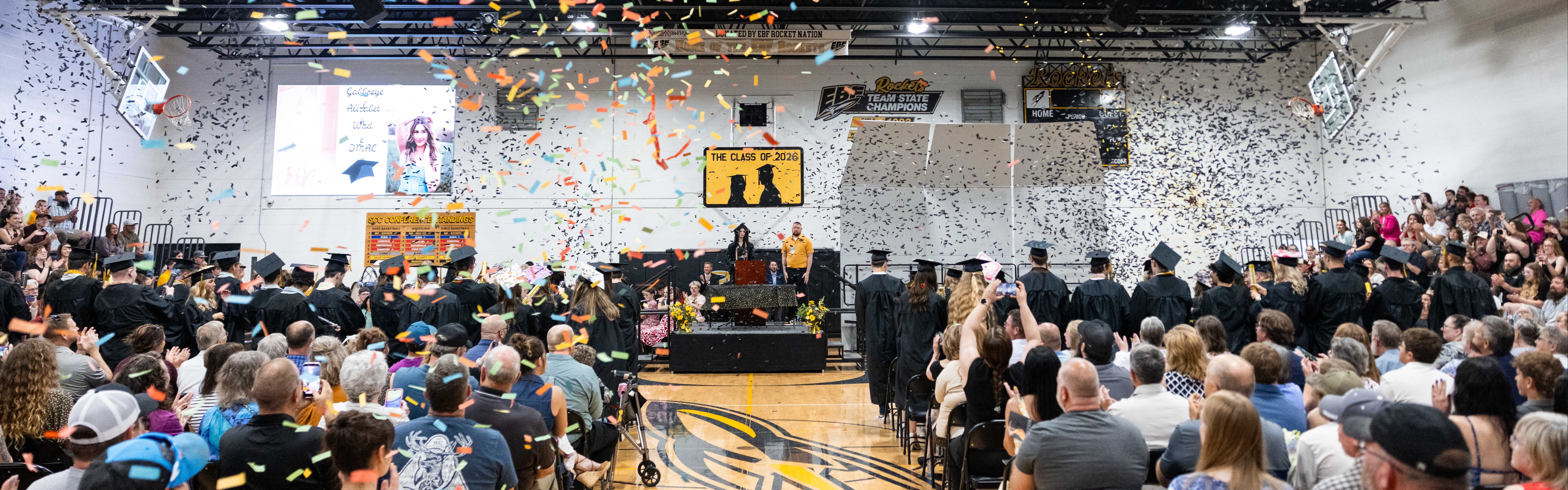 EBF 2026 Graduates celebrate with confetti as audience looks on