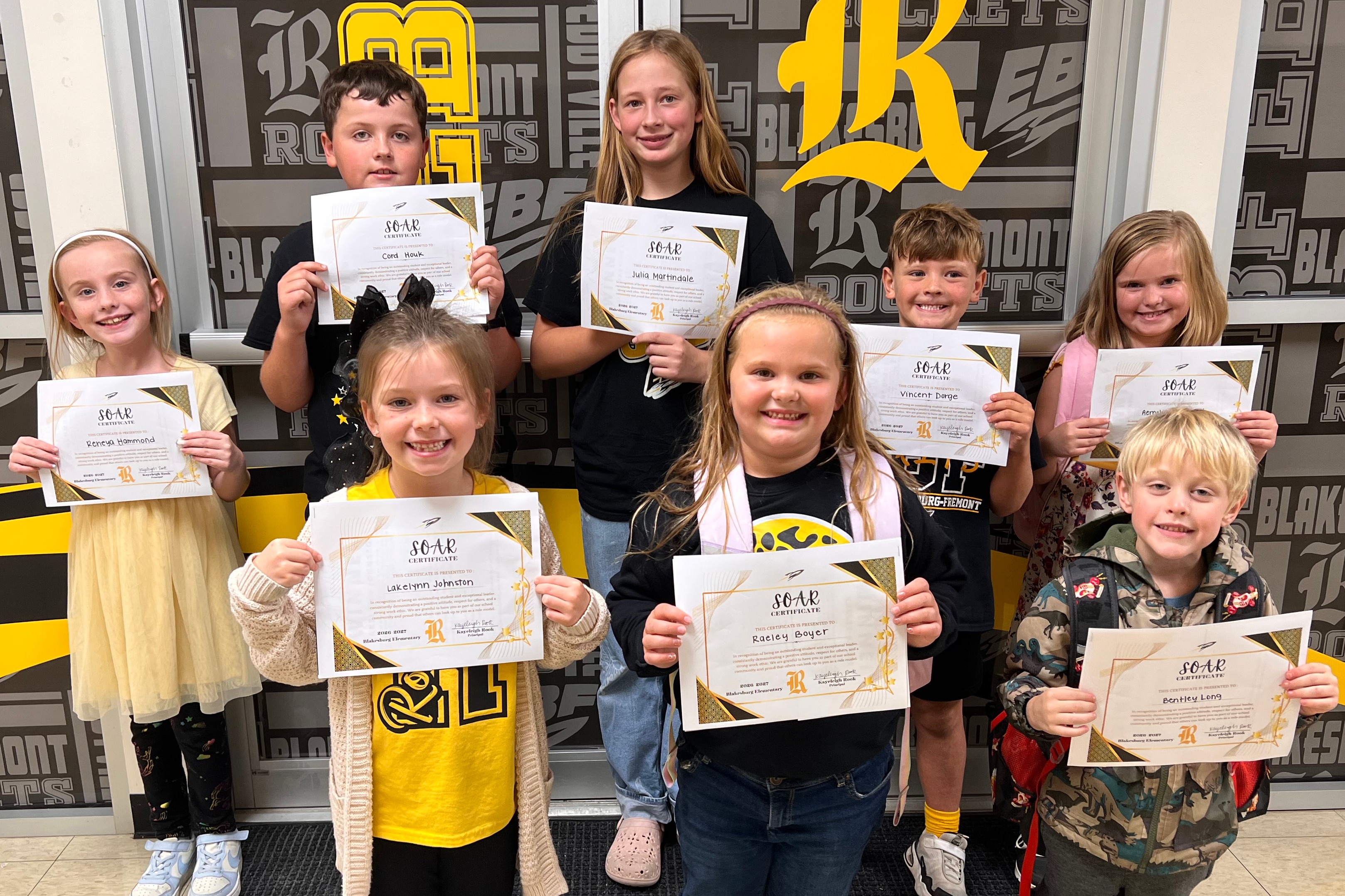 Group of Blakesburg Elementary students holding certificates, recognized as monthly SOAR Students.