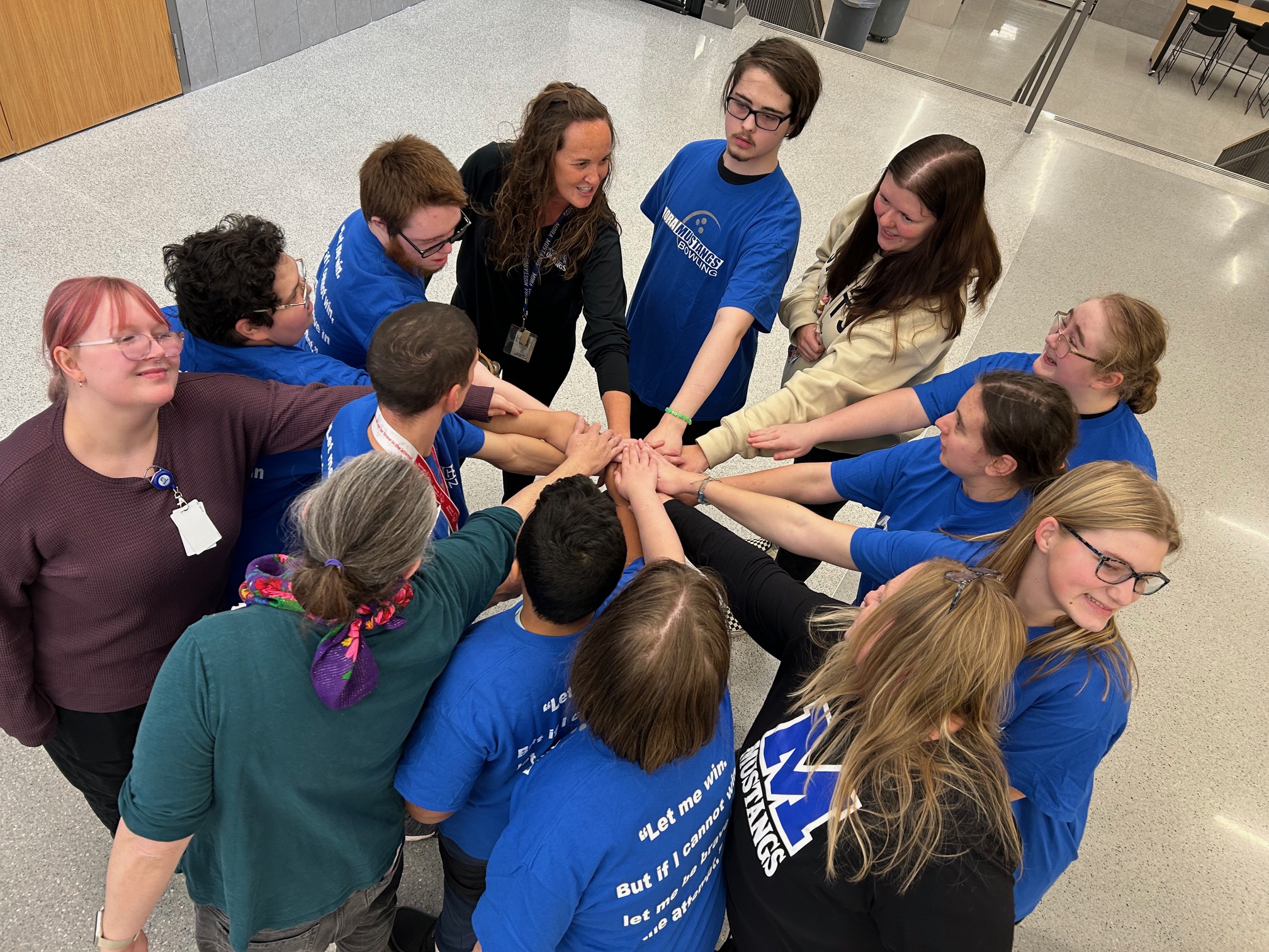 Special Education Bowling Team Doing a Group Huddle Before heading to State!