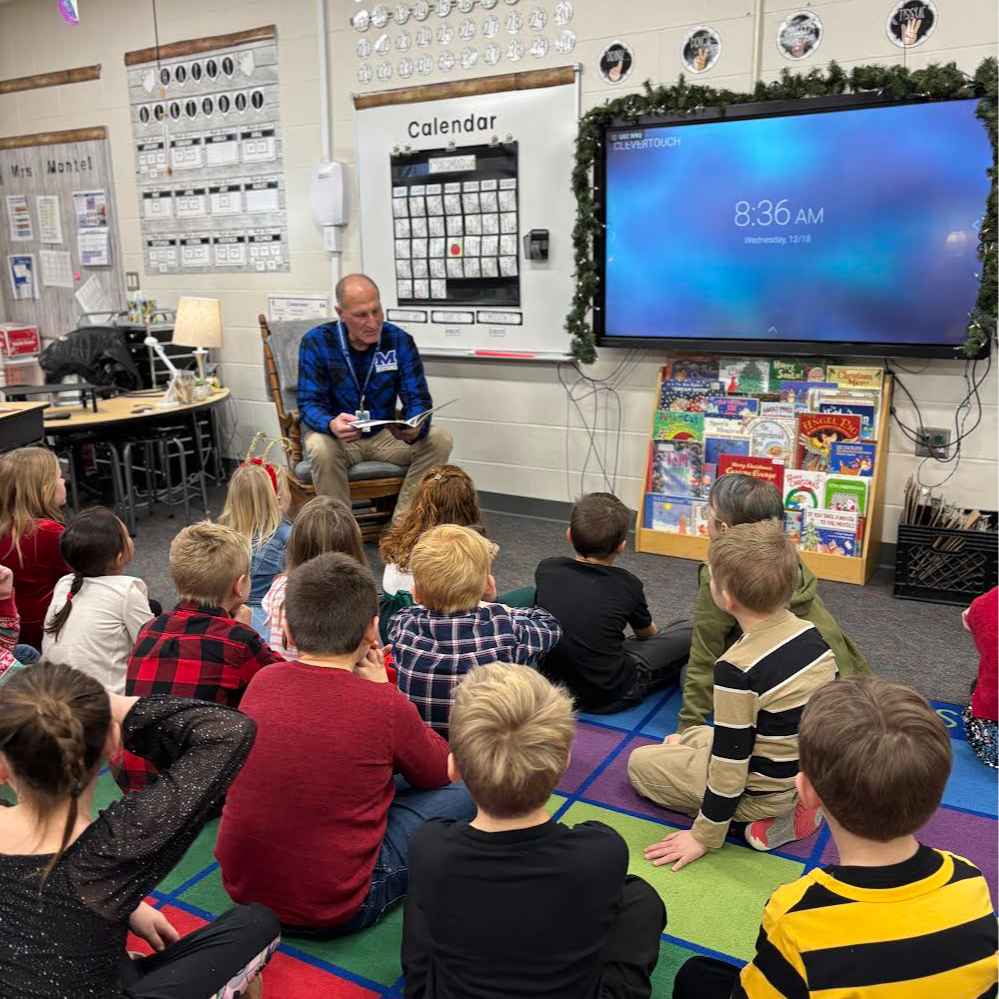 Mr. Voce visiting with our first grade students