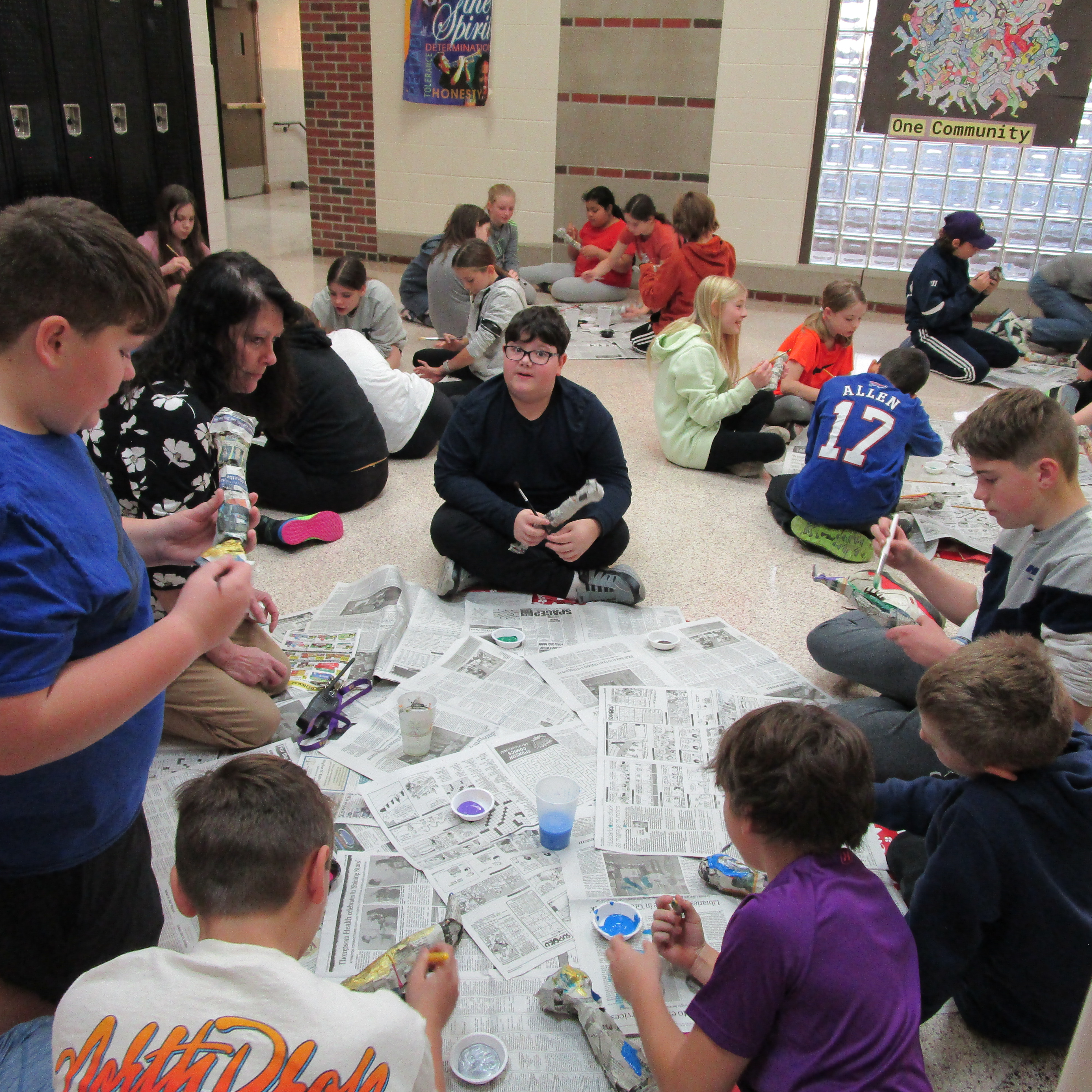 students making mummies in the hall