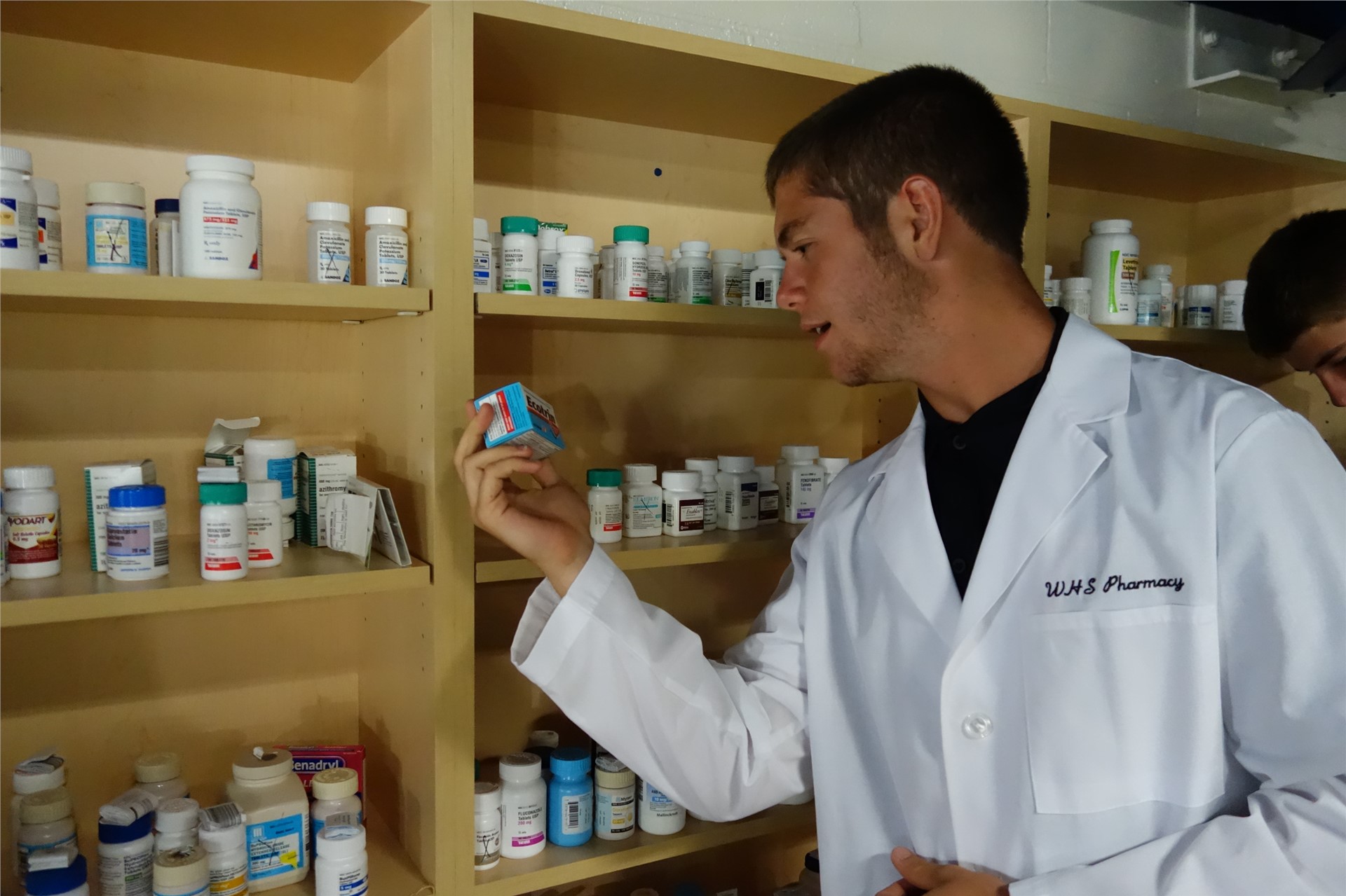 A students picking out medicines