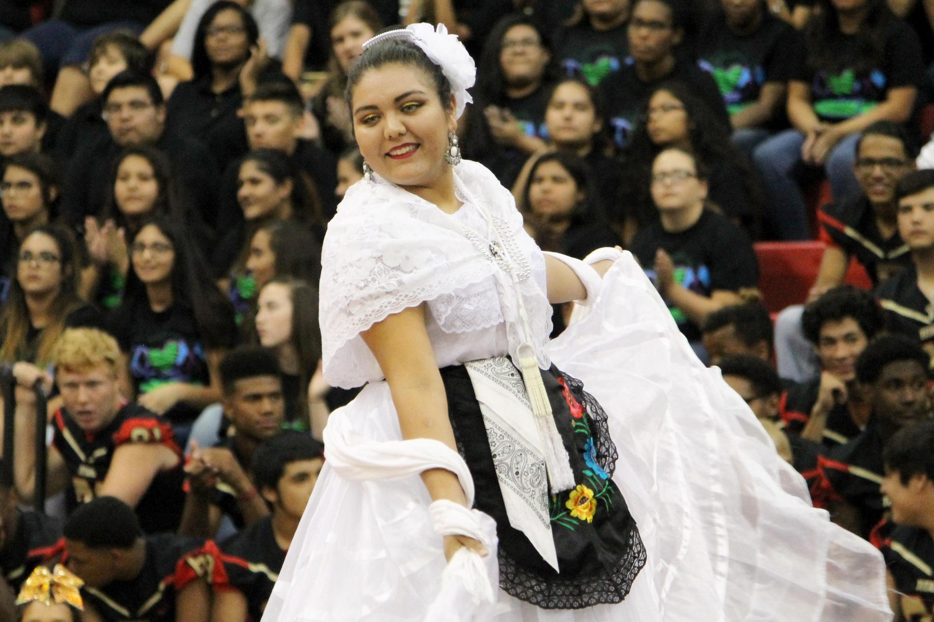 Ballet Folklorico:  Performer Dancing in a white dress.