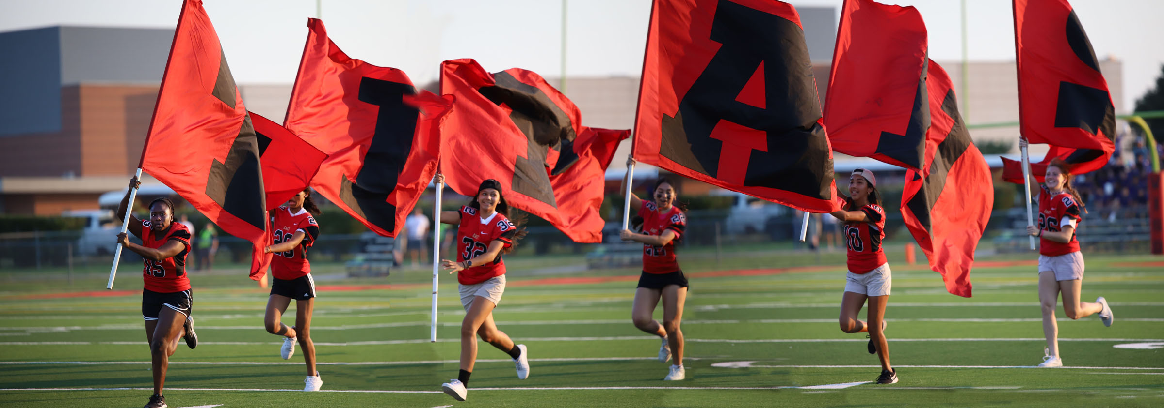 STUCO ladies run flags after first touchdown against CC Carroll Sept. 9.