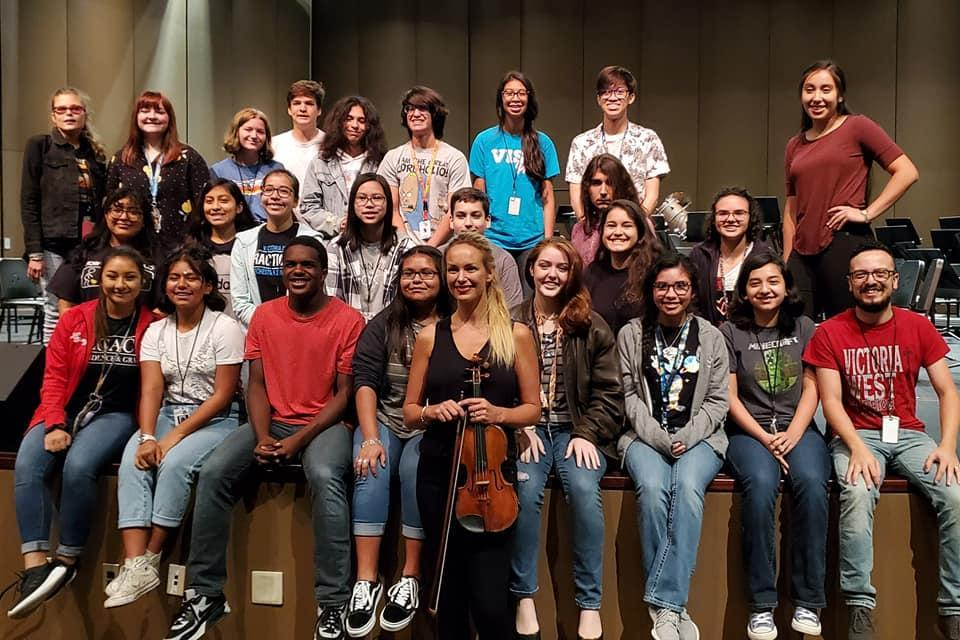 Orchestra students and instructor