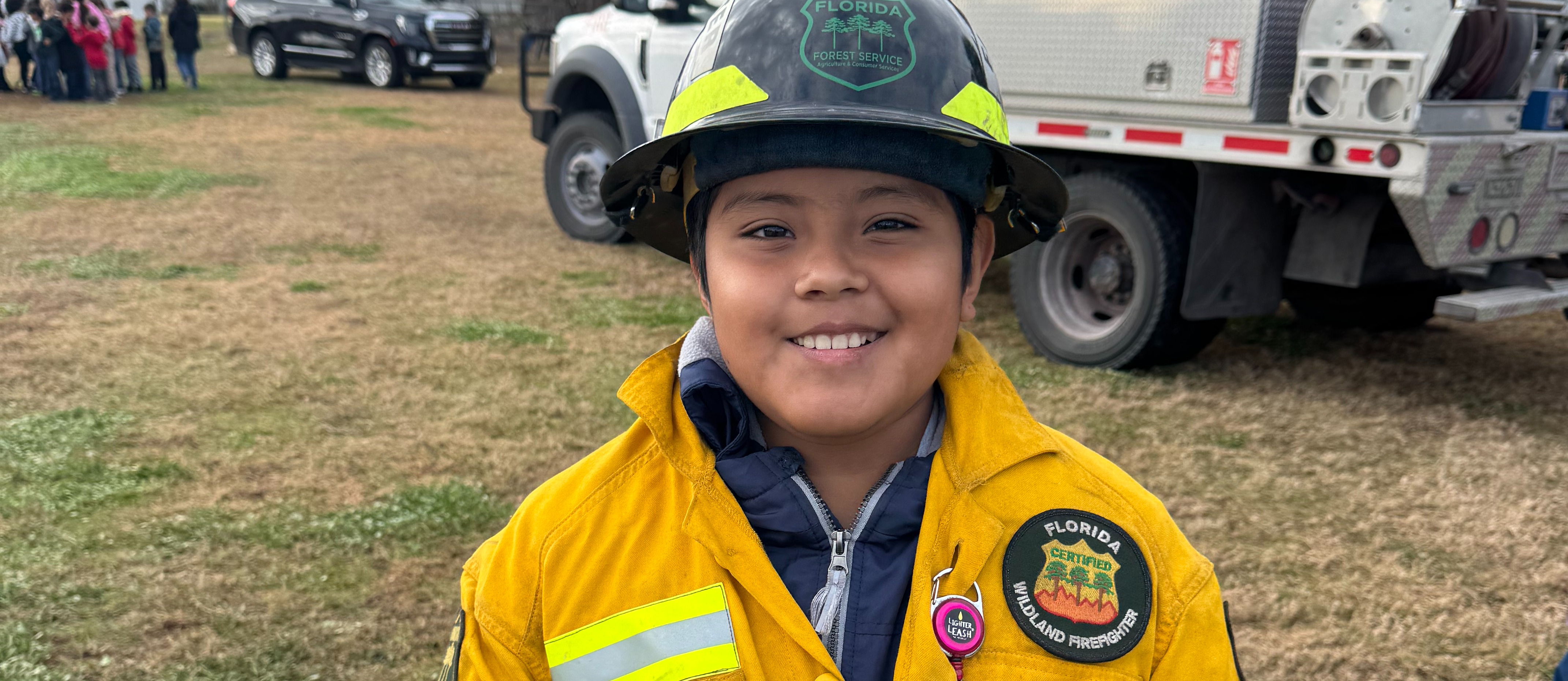 student in firefighter gear