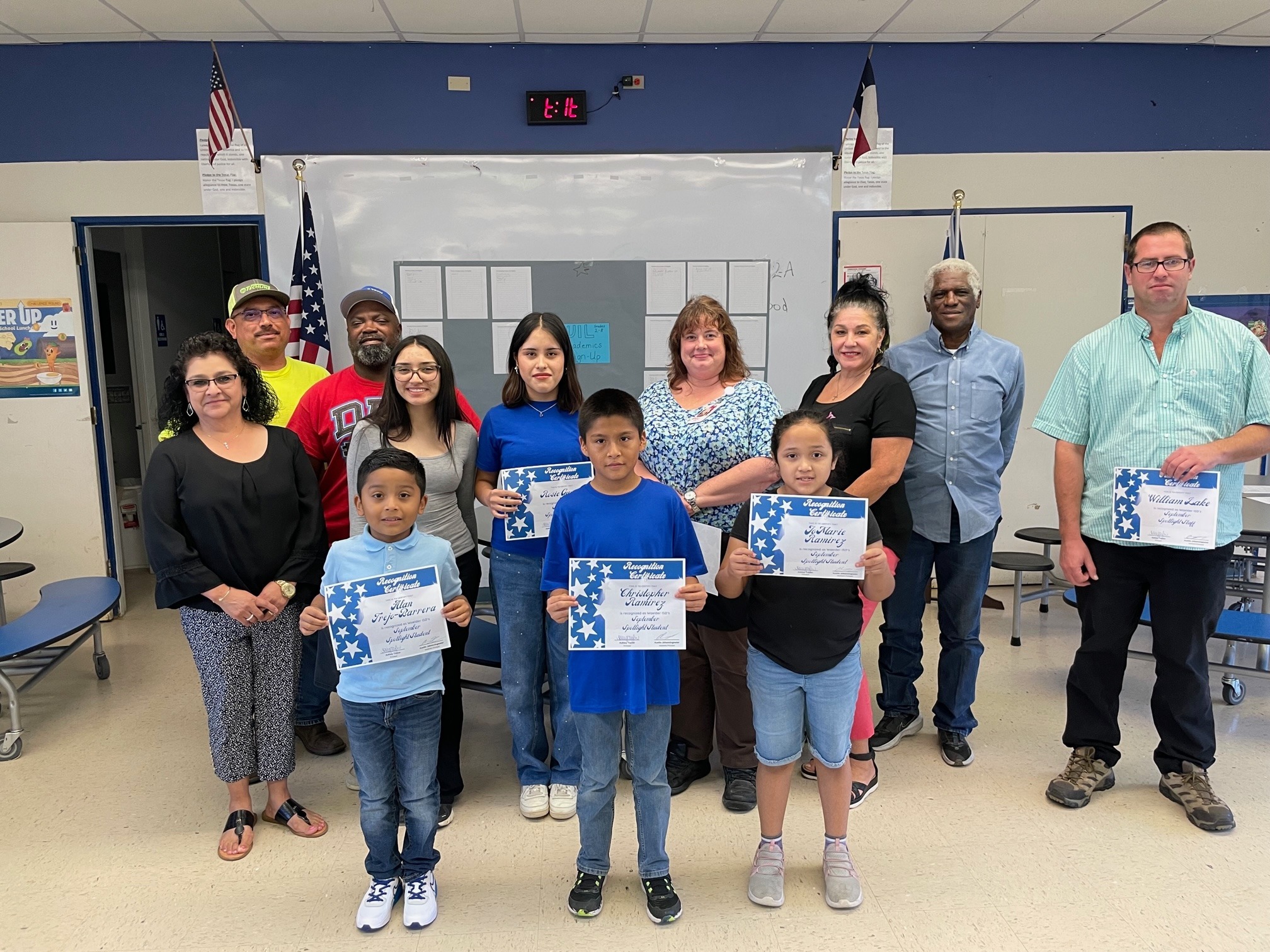 Staff and students smiling