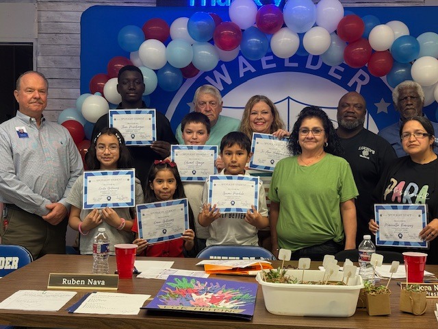 Staff and students smiling