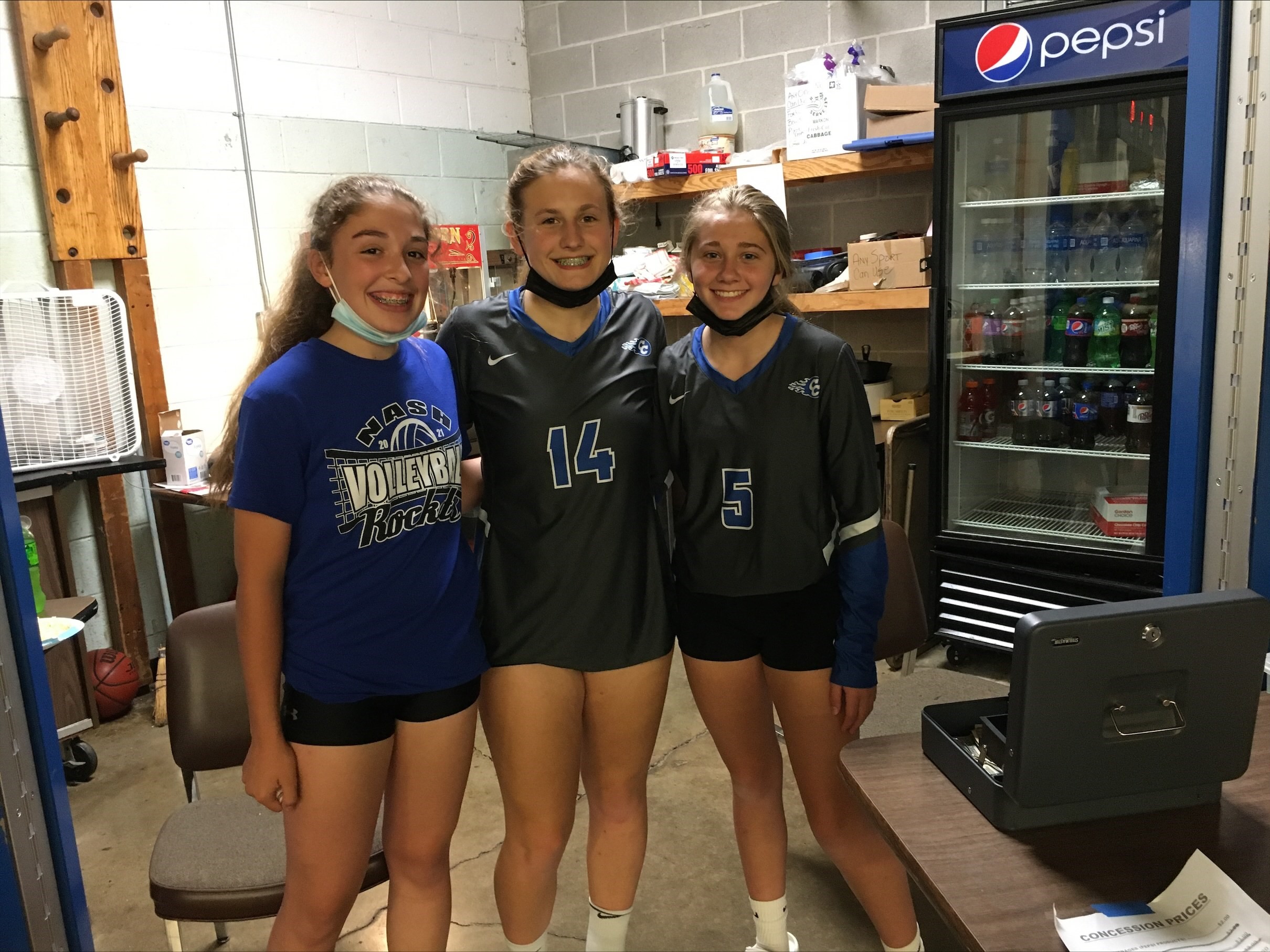 Alivia, Gracie and Madison working volleyball concessions