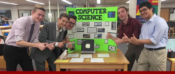 A group of five students with their presentation of Computer Science