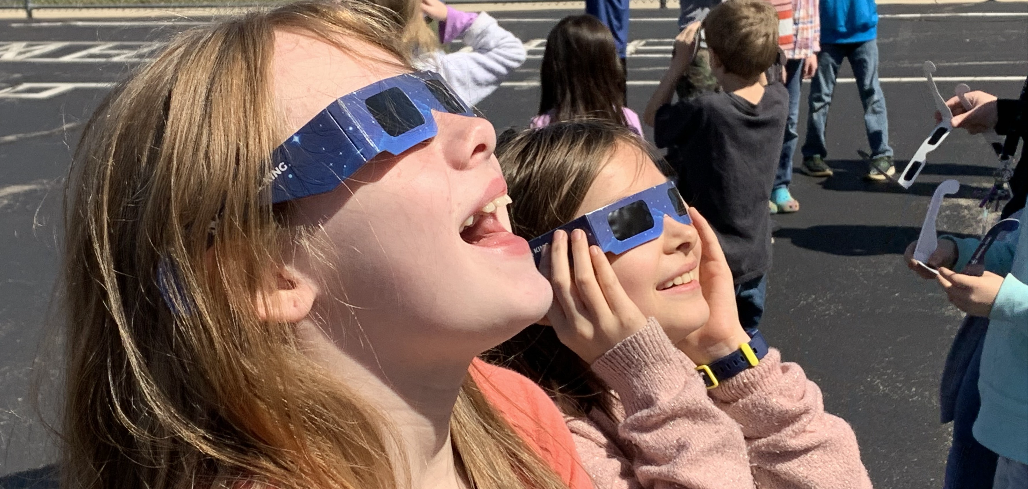 Lincoln kids with solar eclipse glasses on