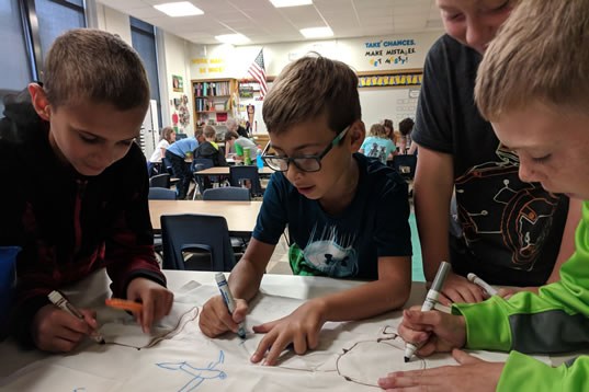 Four students working together