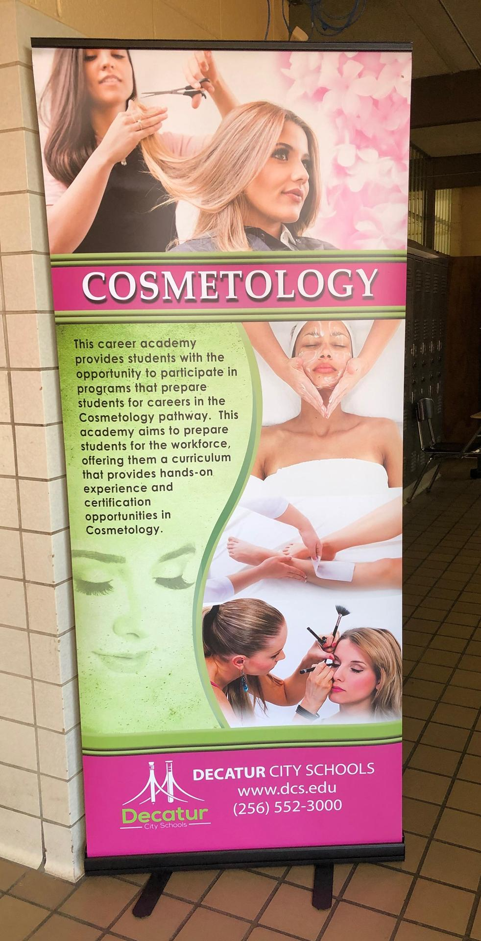 Cosmetology banner that says This career academy provides students with the opportunity to participate in programs that prepare students for careers in Cosmetology pathway. This academy aims to prepare students for the workforce, offering them a curriculum that provides hands-on experience and certification opportunities in cosmetology. Decatur city schools