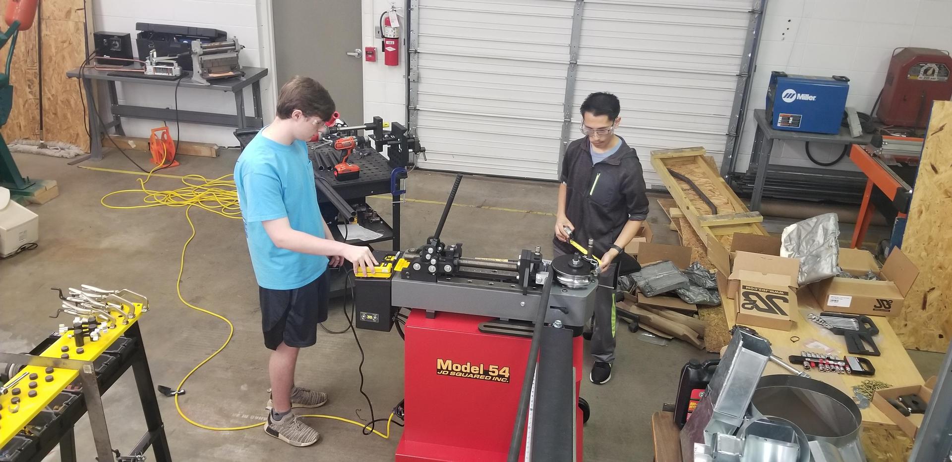 Students working in a garage type lab