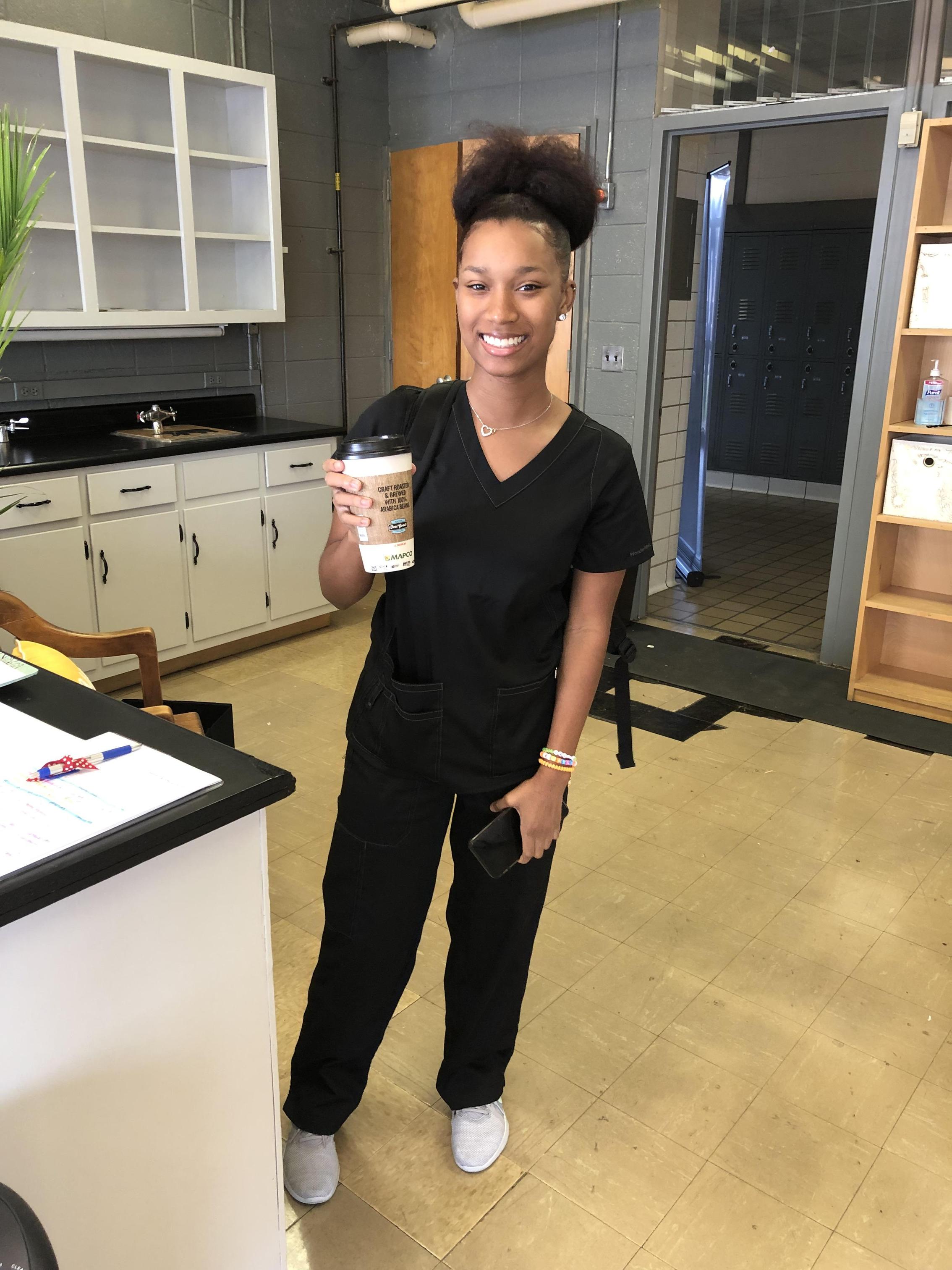 Student with a coffee cup