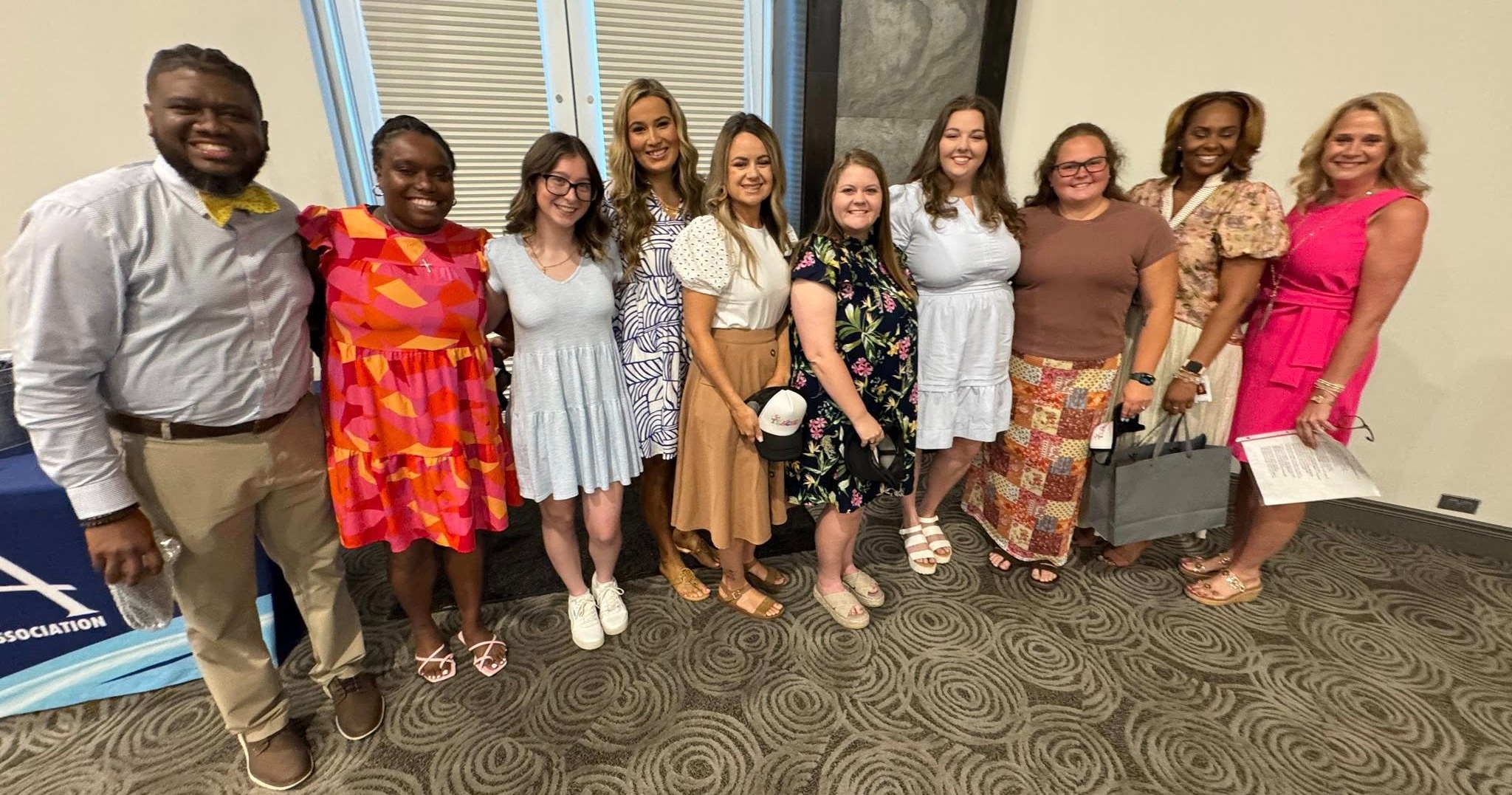 Image of new teachers being celebrated during New Teacher breakfast.