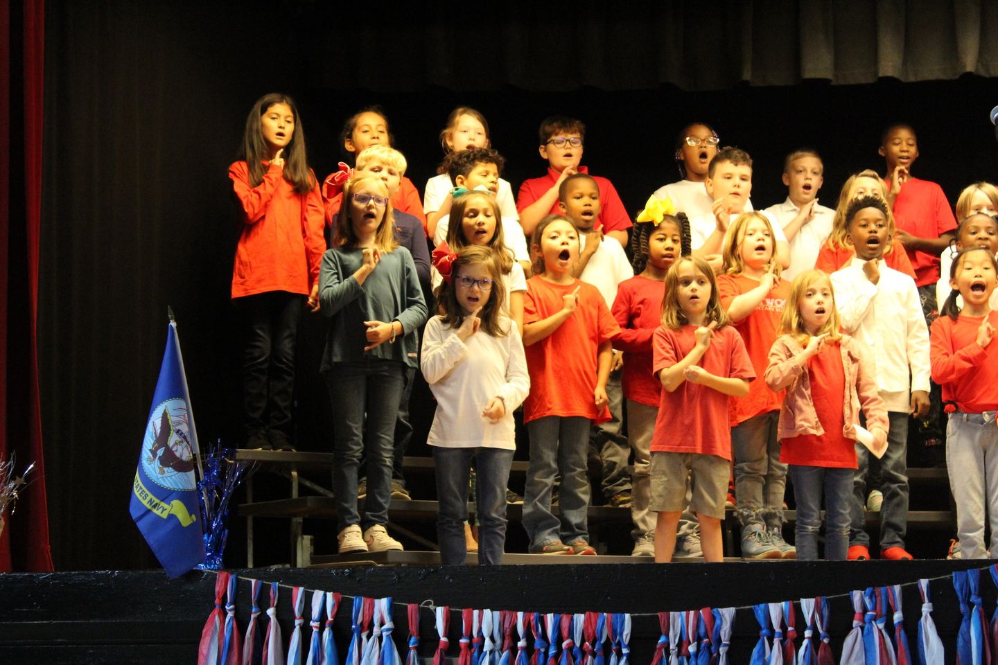 Students pledging allegiance to the flag. 