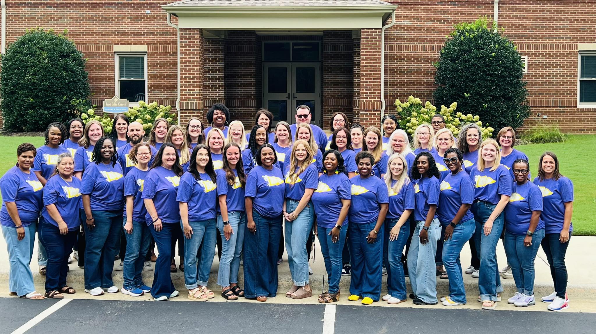 This is a picture of all of our faculty standing in front of First Bible Church. 