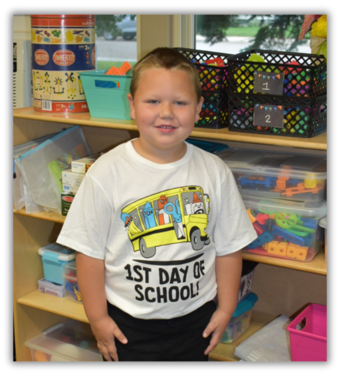 young boy student wearing first day of school photo