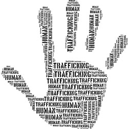 Image of human hand with the words human trafficking