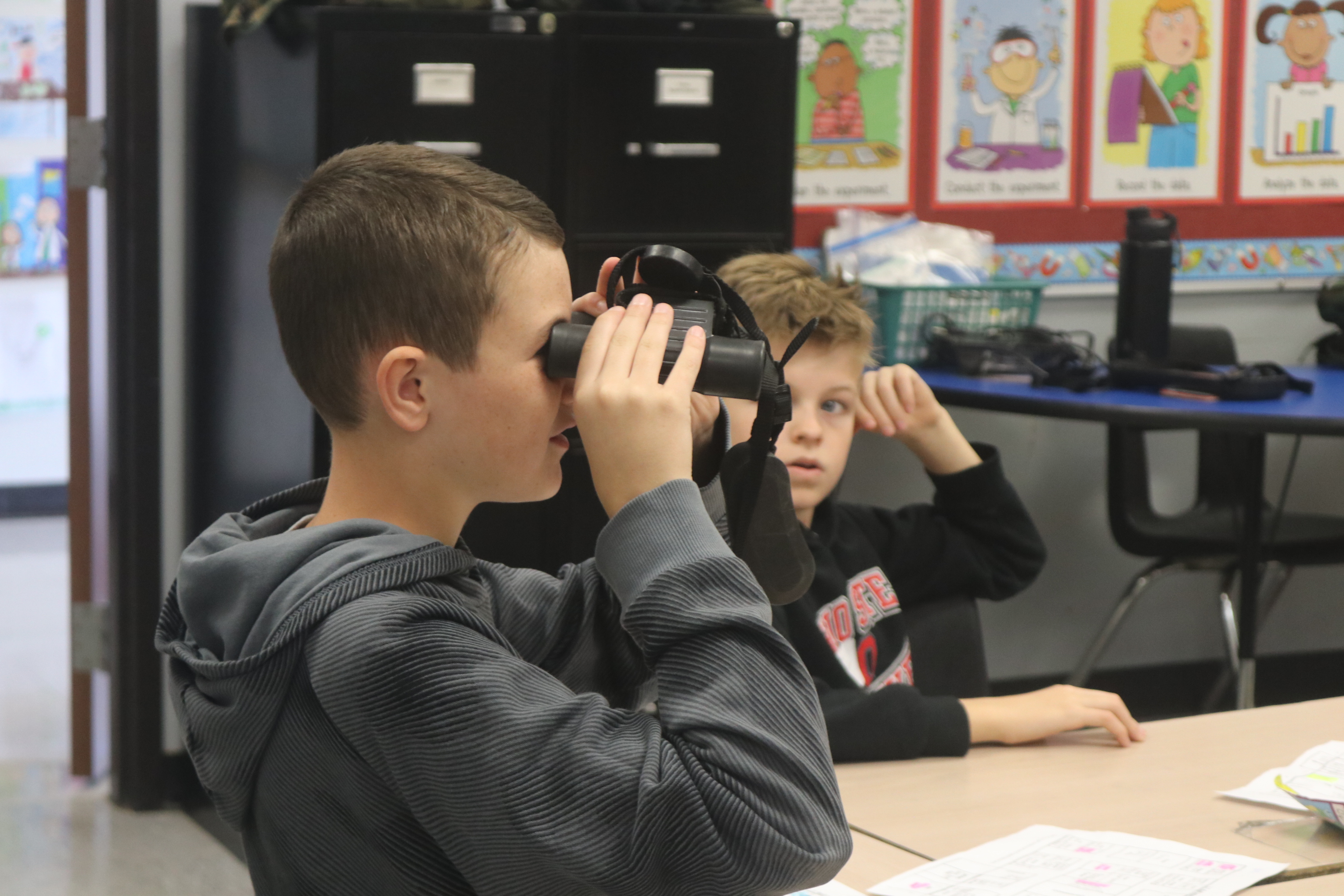 Looking through military binoculars.  