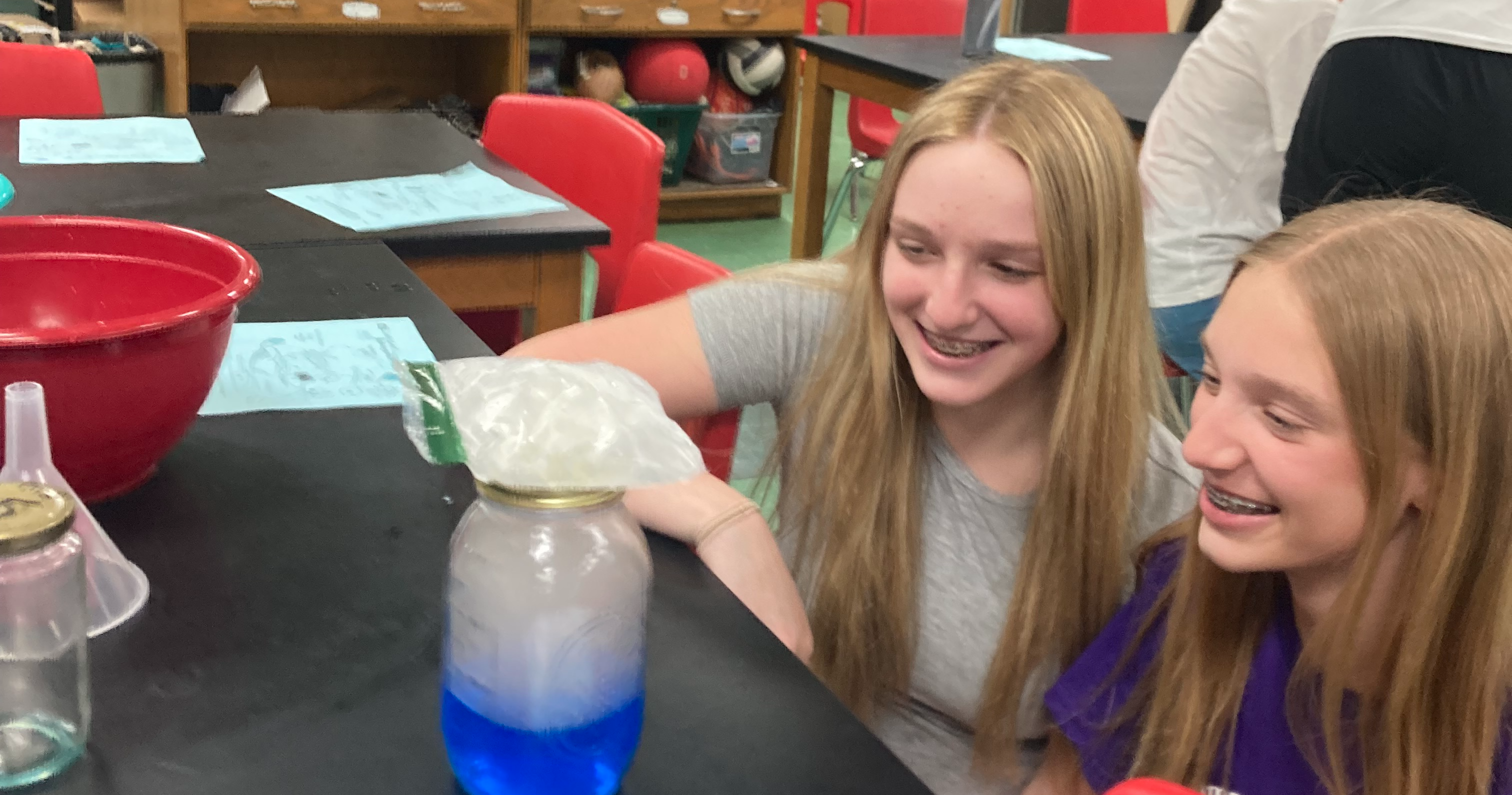 TMS students in science lab react to experiment.  