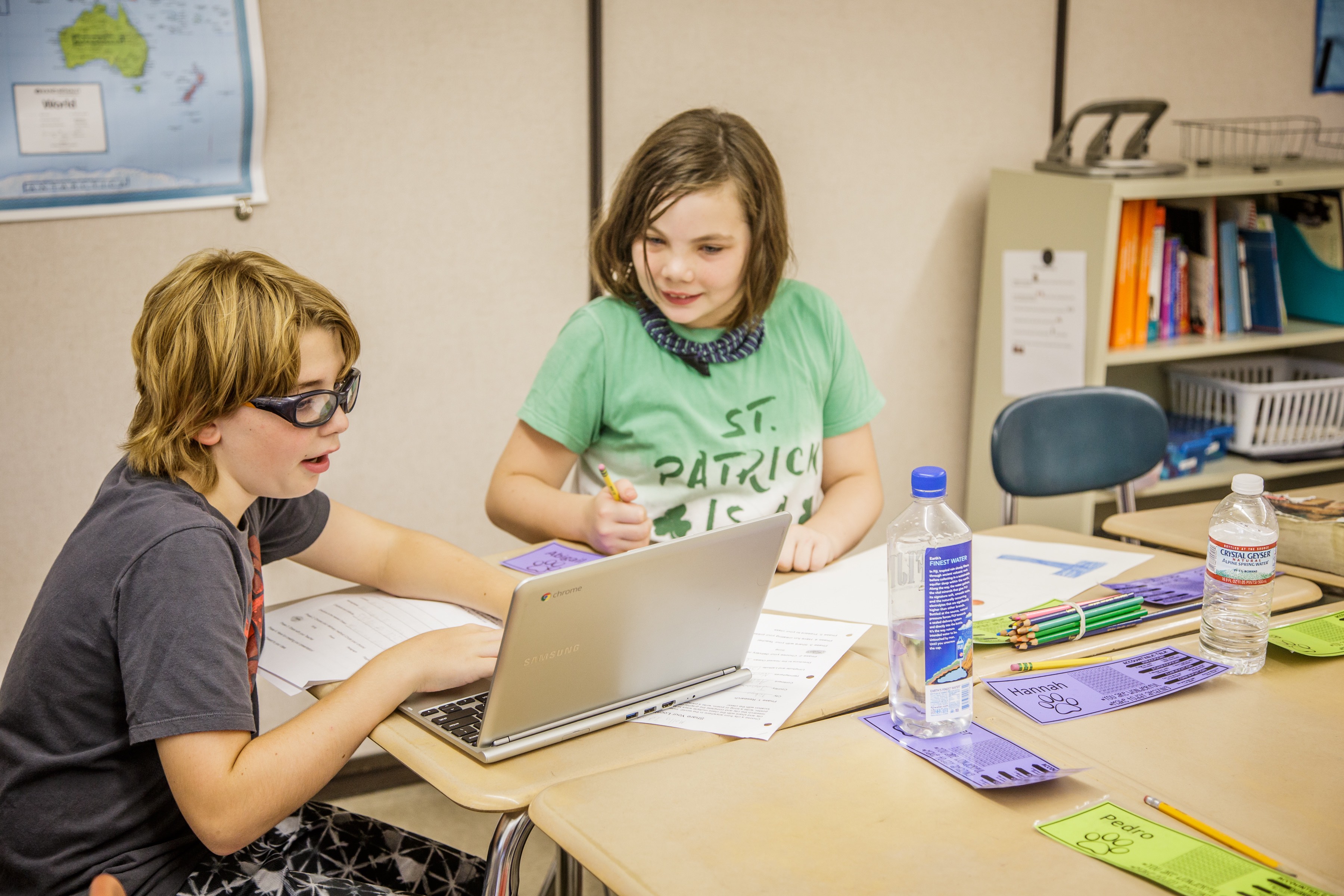 students work on a chromebook